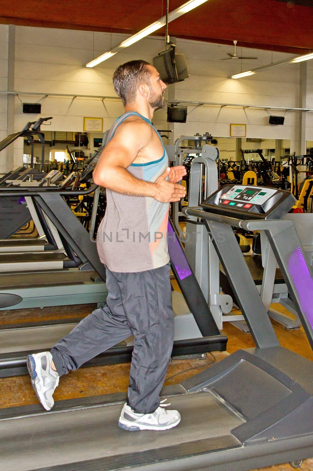 Man in the studio on the treadmill