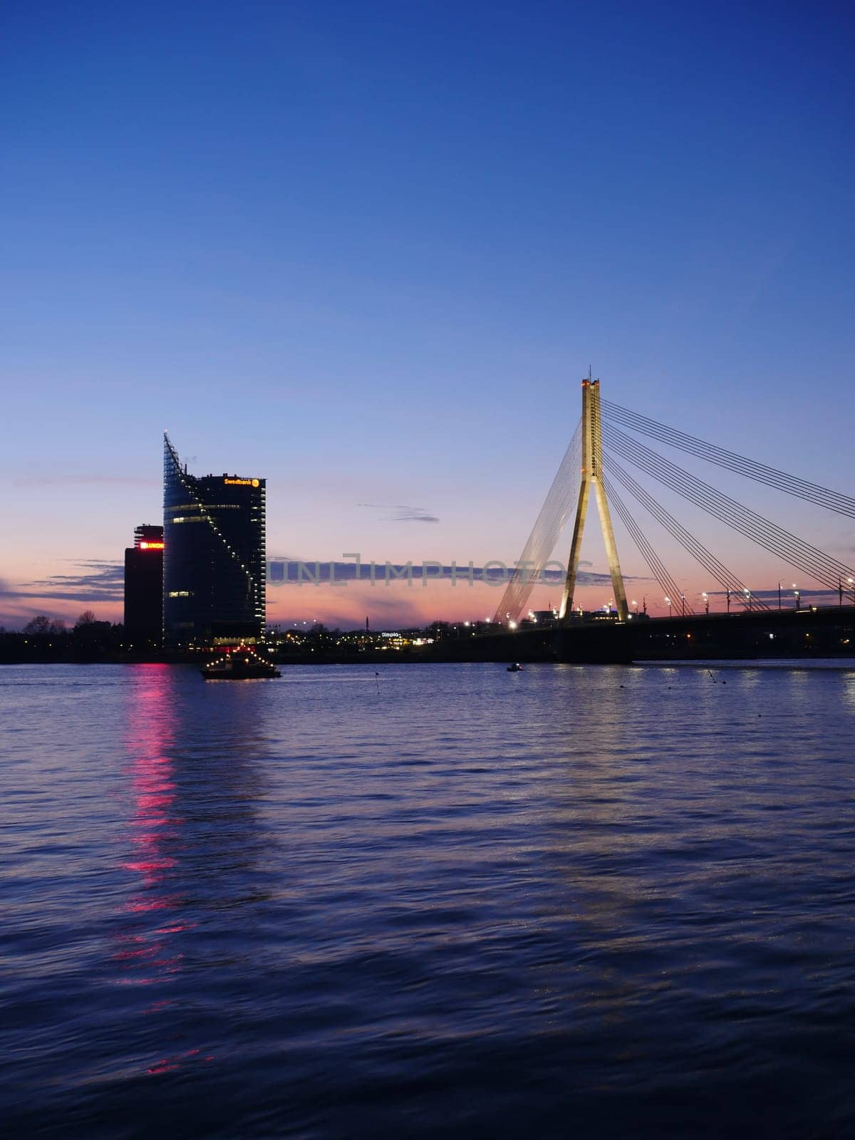 View of Riga river and Vansu Bridge in evening