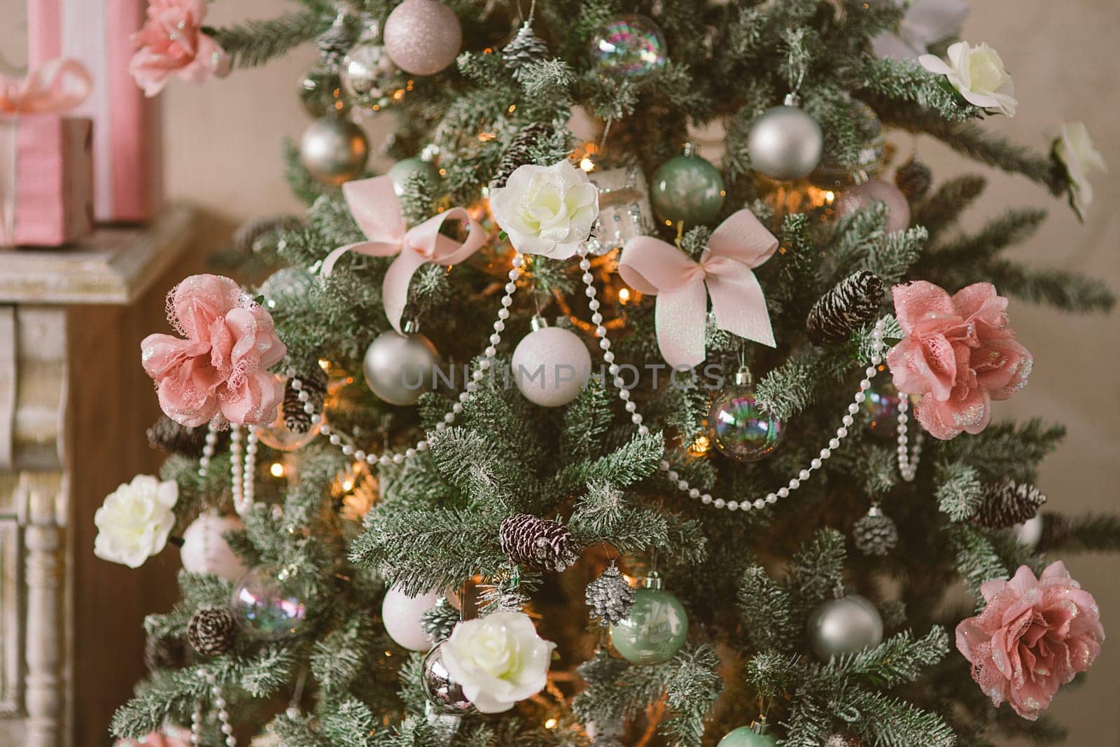 New Year's and Christmas interior in pink color with a dresser, gifts