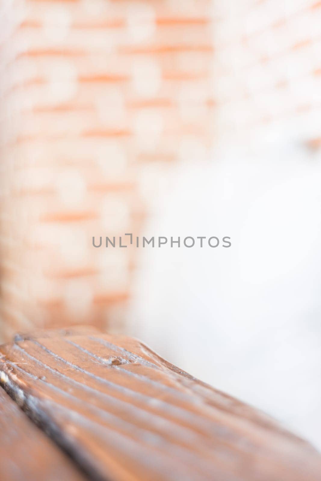 Grey pillow on a brick wall background, stock photo