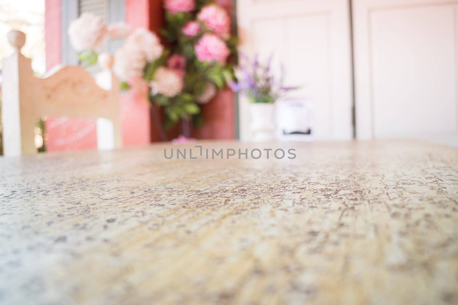 Wooden table decorated with flower bouquet, stock photo