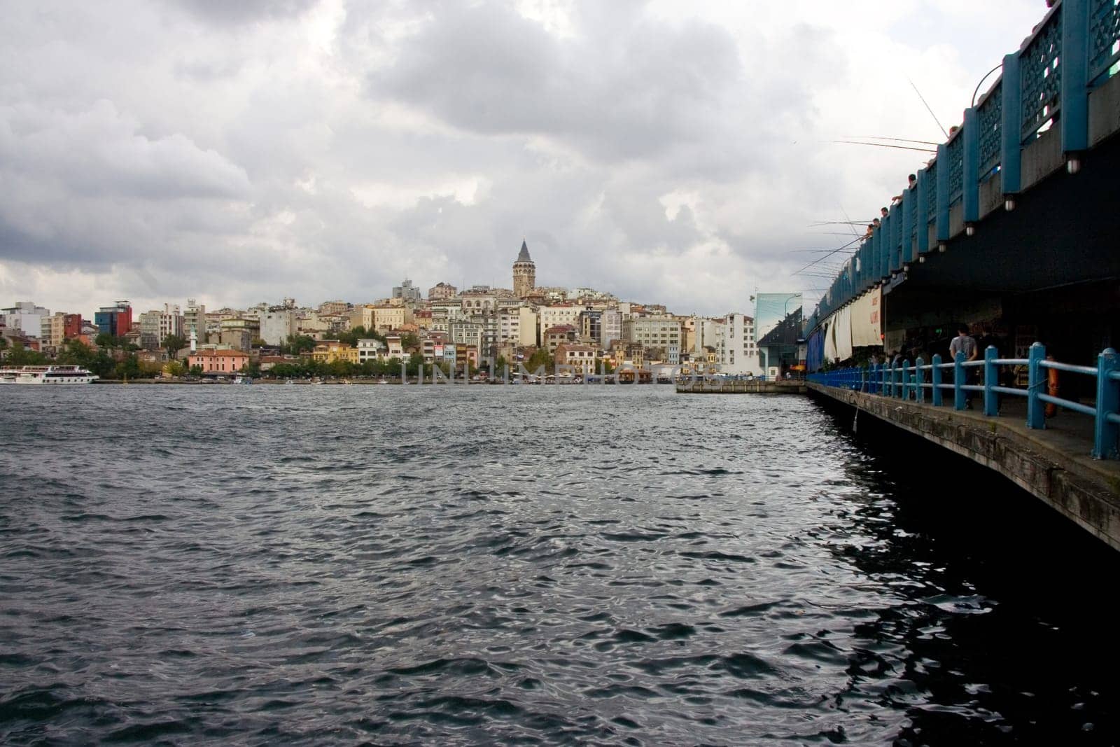 The Galata Bridge, Galata Koprusu with fishermen.Caught fish are sold to restaurants in the lower parts of the bridge