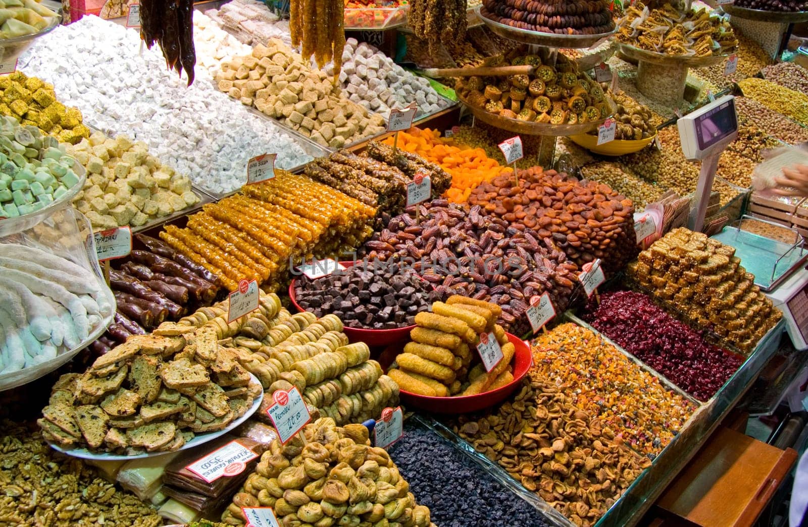 Showing of Turkish sweets, dried fruits and nuts in a stall in the Istanbul spice market