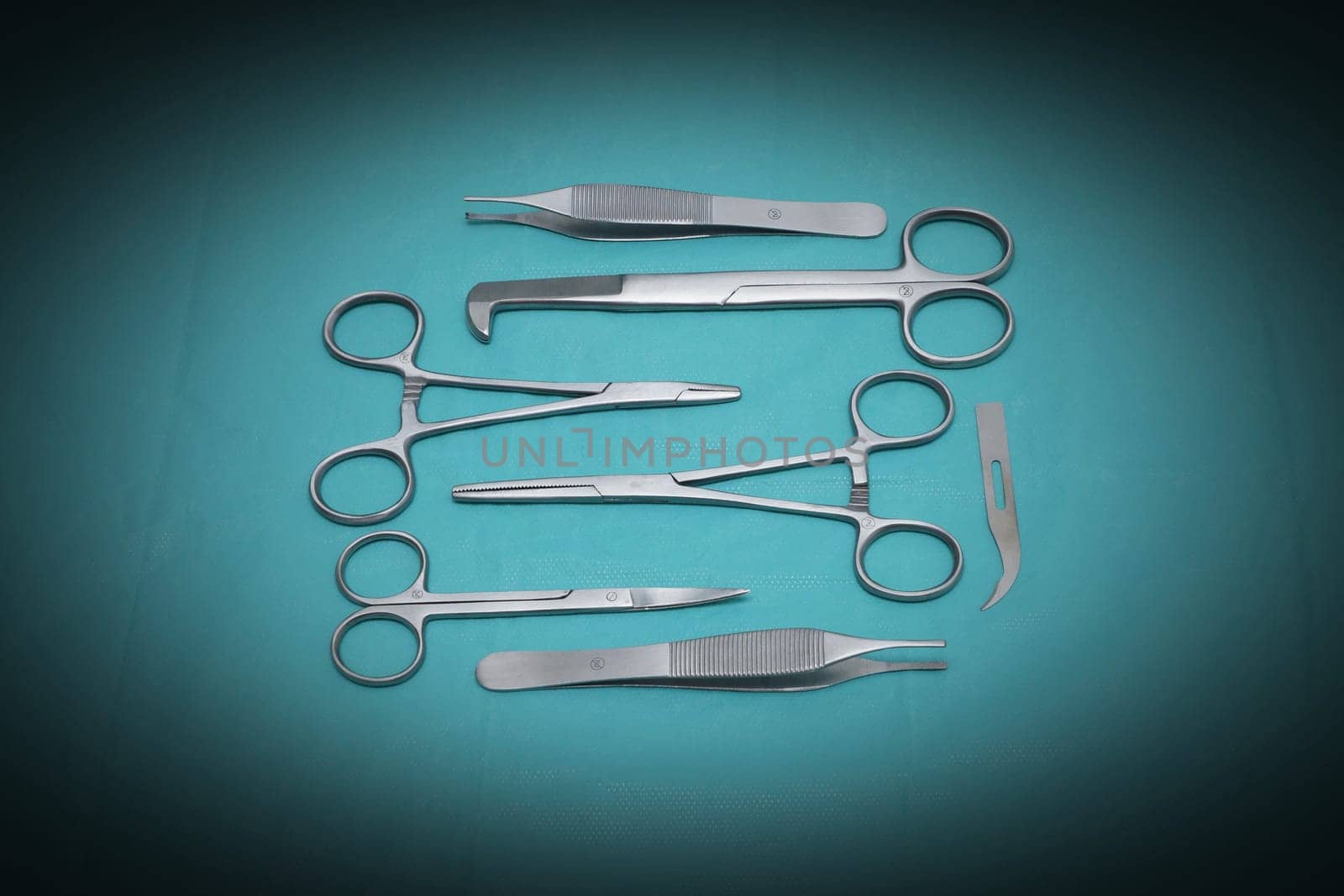 Different scissors on blue background