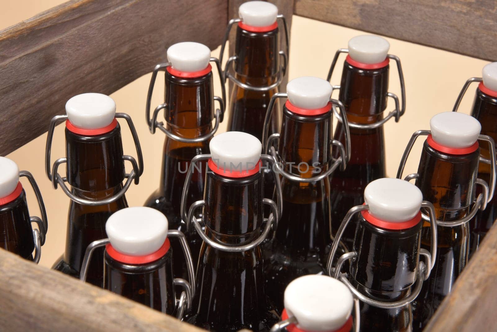 Close-up of many beer bottles with ironing closure in old beer box