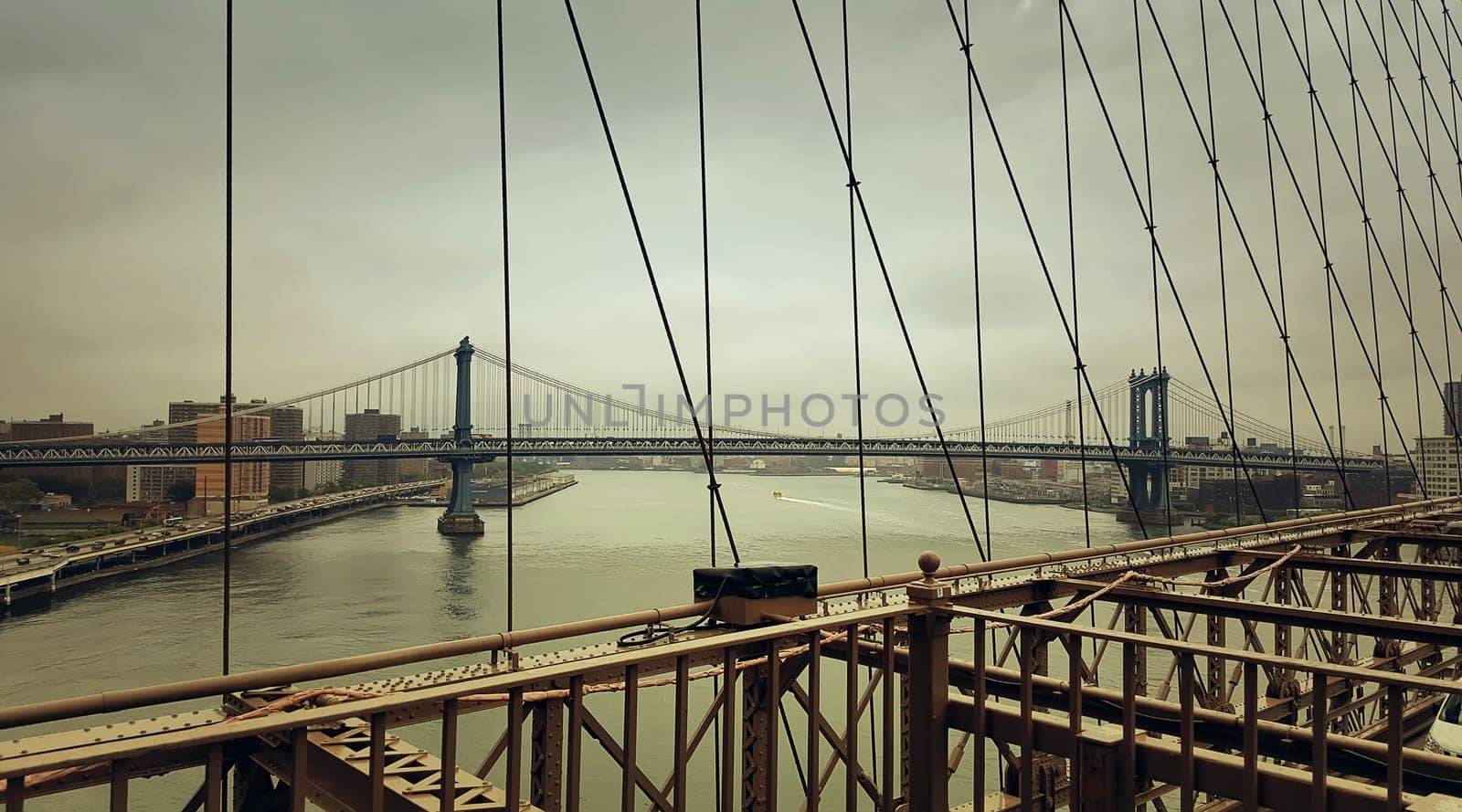 A look from Brooklyn Bridge to Manhattan Bridge over Hudson River in New York City