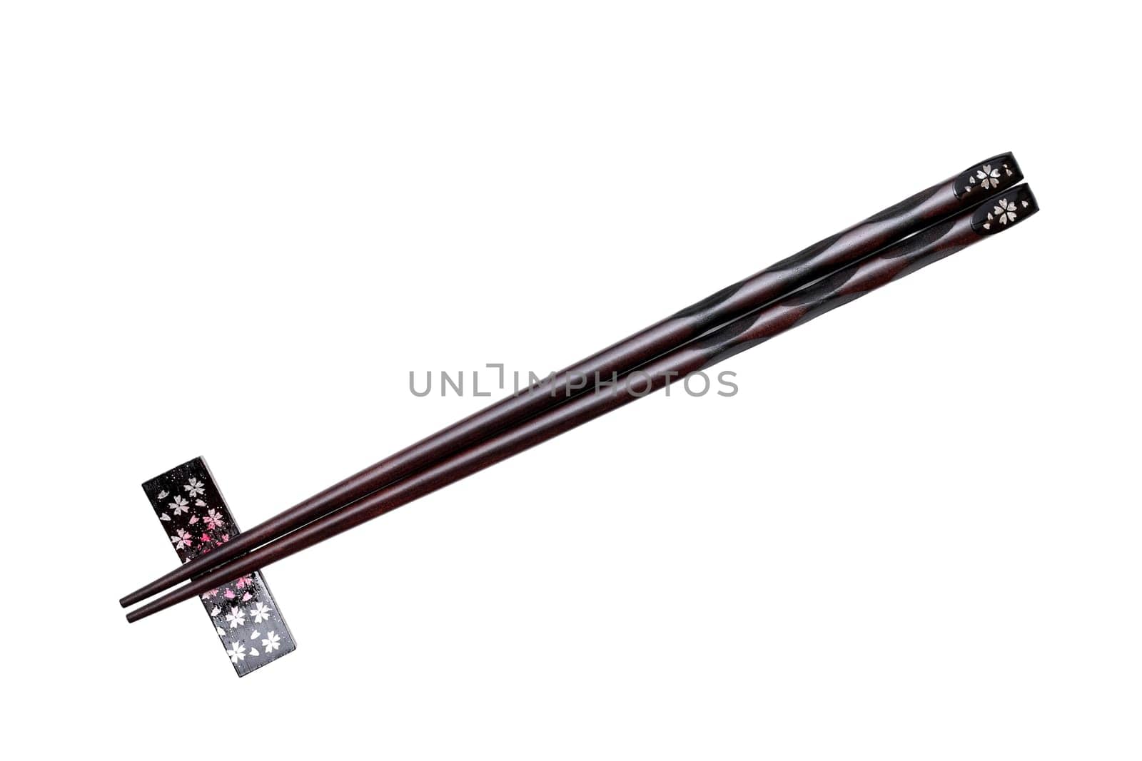 chopsticks and chopsticks rest isolated on white background
