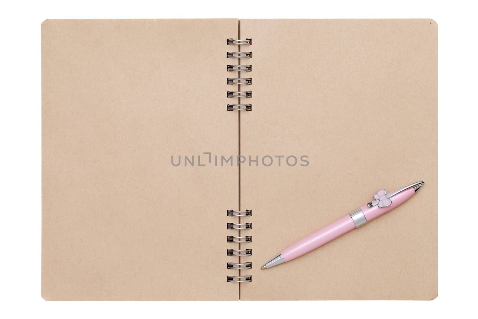 blank spiral brown notebook with ball point pen isolated on white background