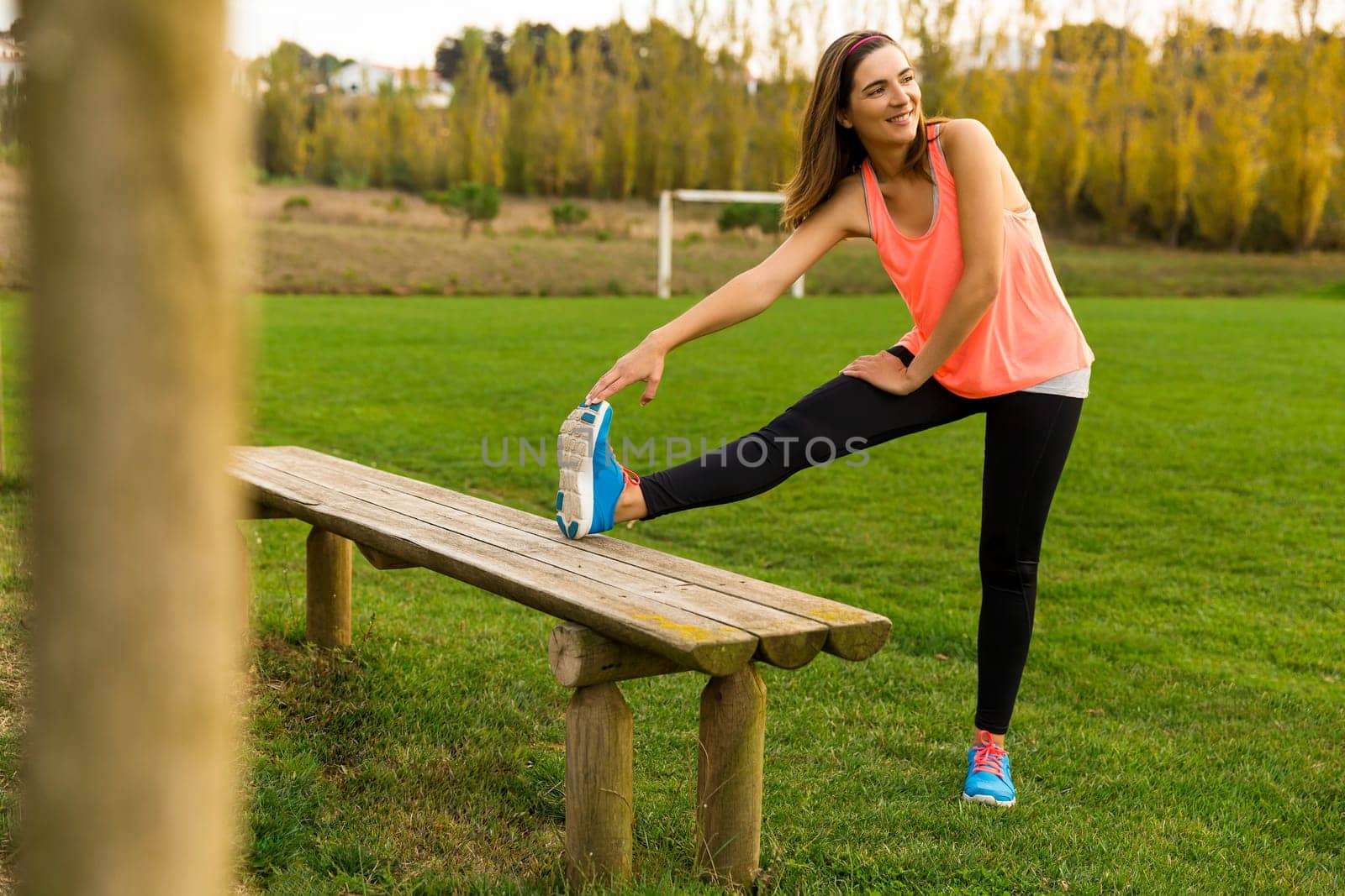 Beautiful woman stretching her muscles after finish the workout