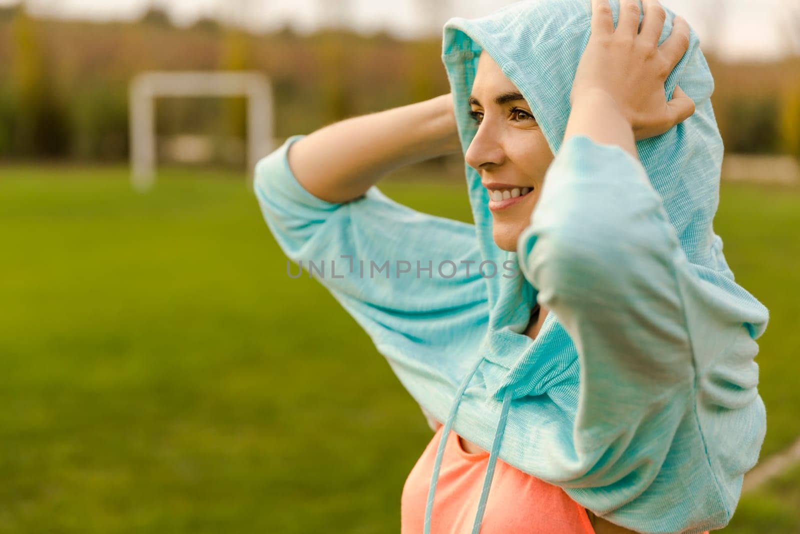 Beautiful woman wearing something warm after exercise
