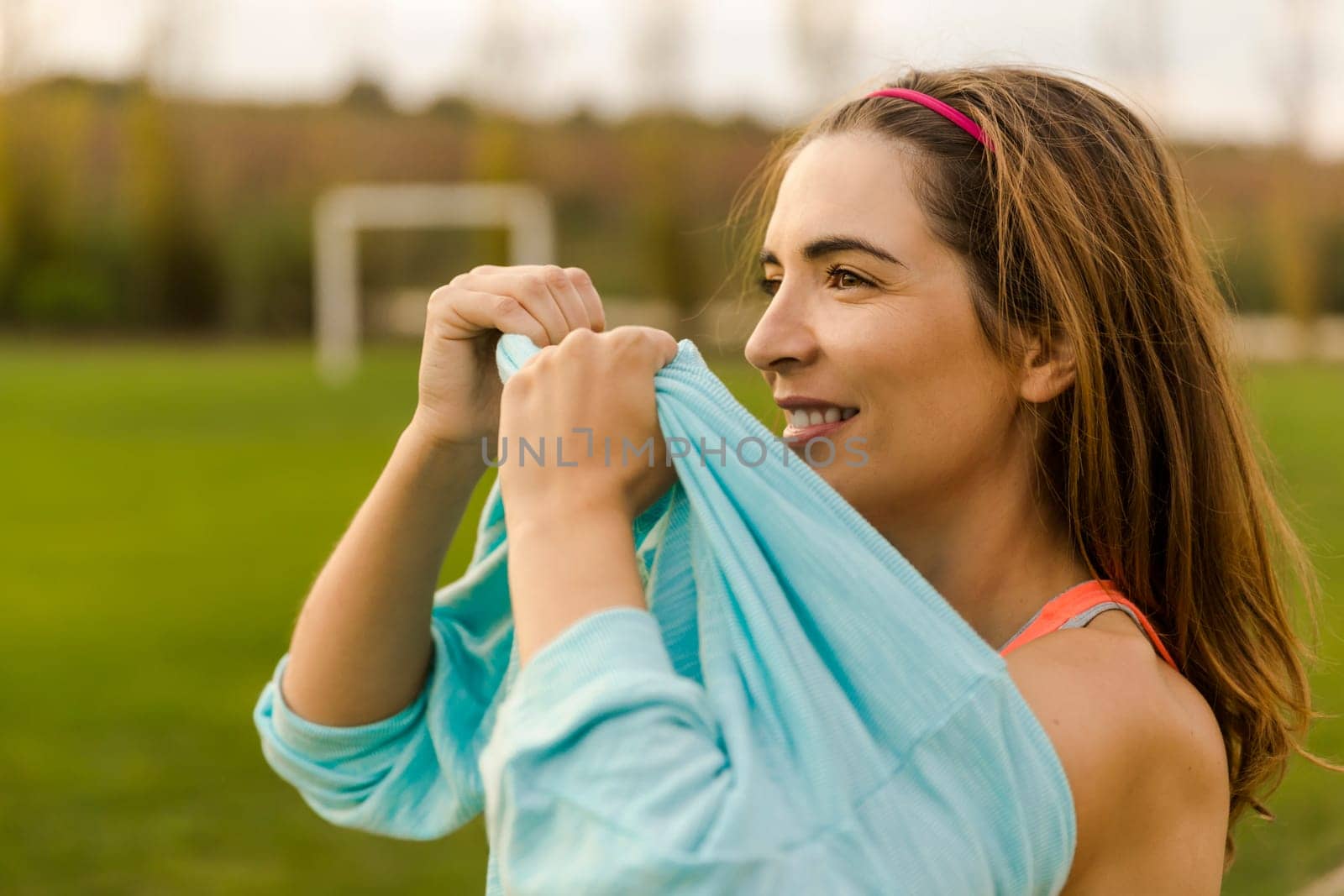 Beautiful woman wearing something warm after exercise