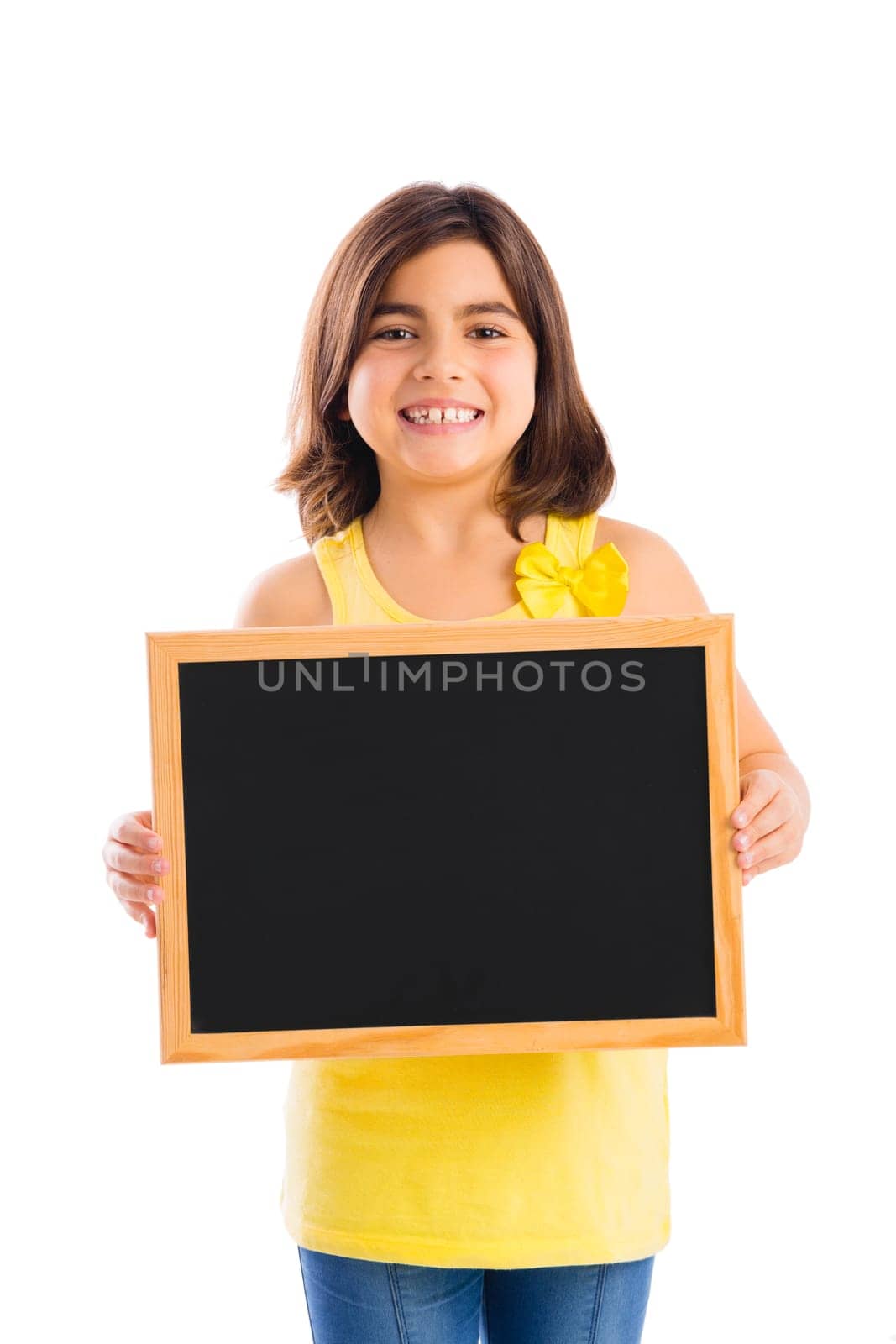 Young girl holding a chalkboard, isolated on white