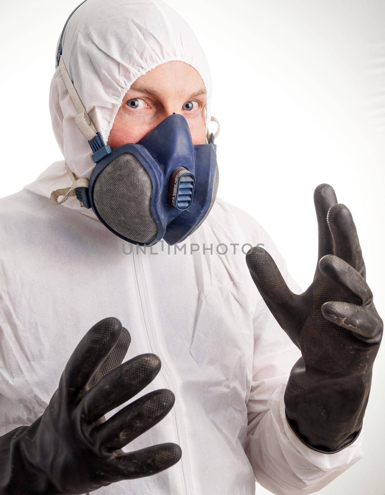 Man in protective suit, gloves and a respiraton