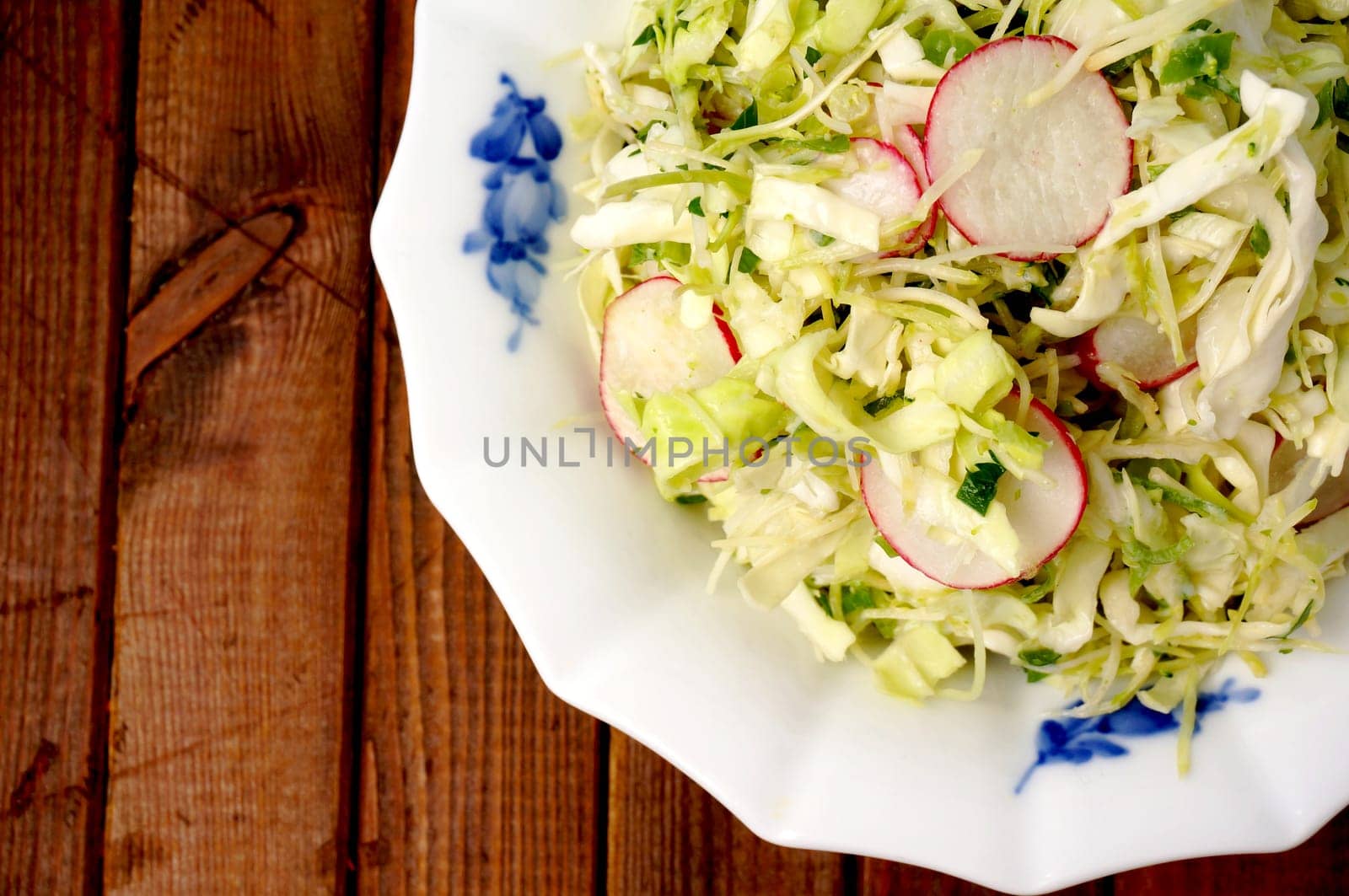 Fresh summer cole slaw garnish with raddish