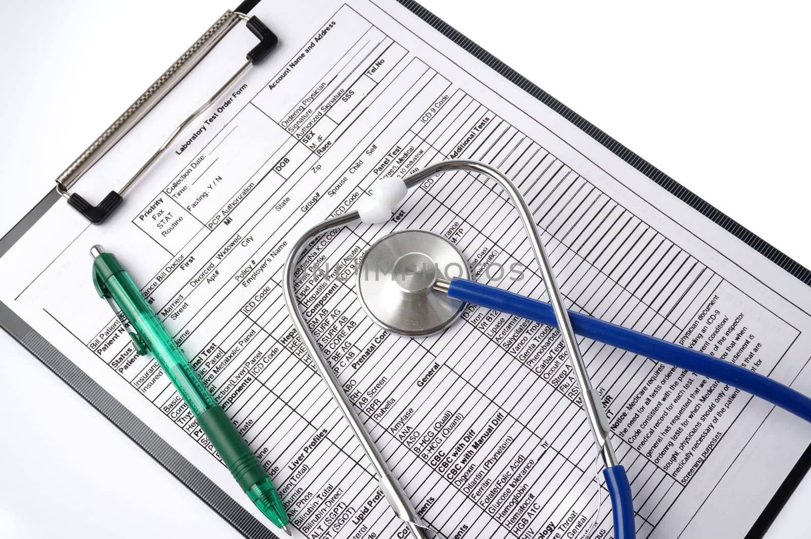 Medical chart with stethoscope and pen, ready to fill