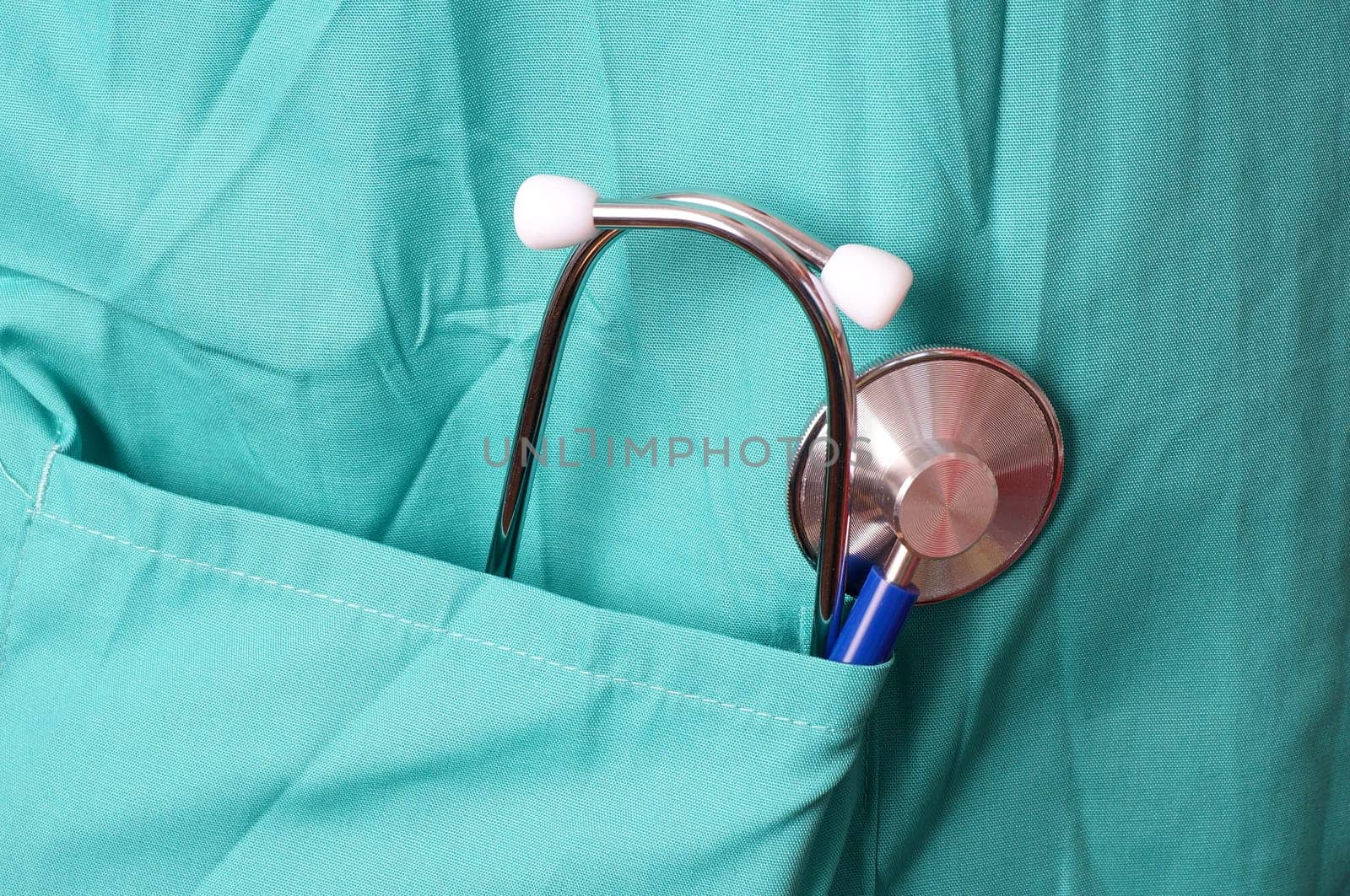 Doctor or Surgeon with stethoscope in pocket