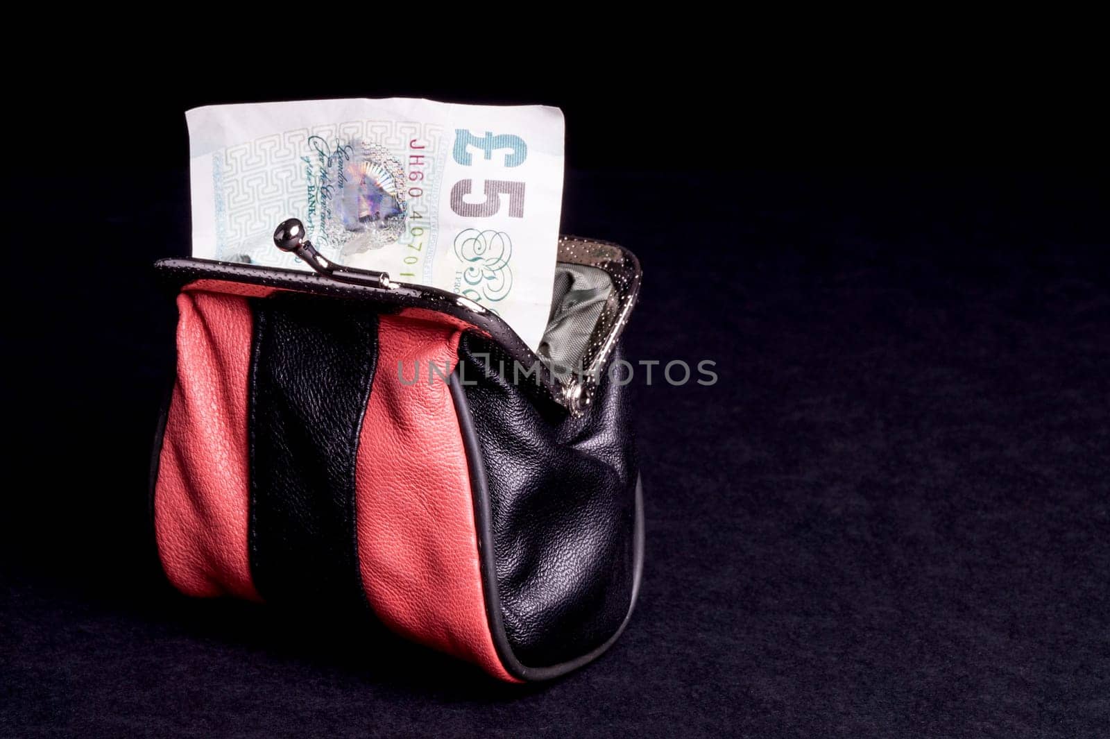 Money in the Purse, with copy space and isolated on Black