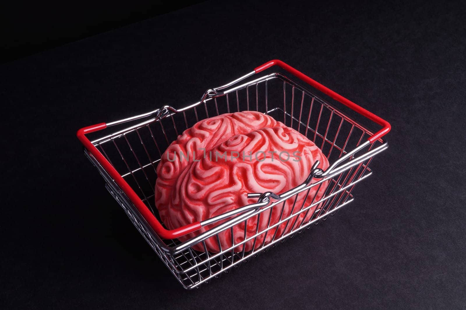 Think before you Bye. Brain and shopping isolated on Black