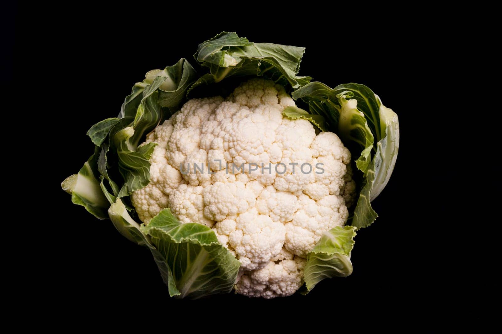 Healthy Organic Cauliflower isolated on black background