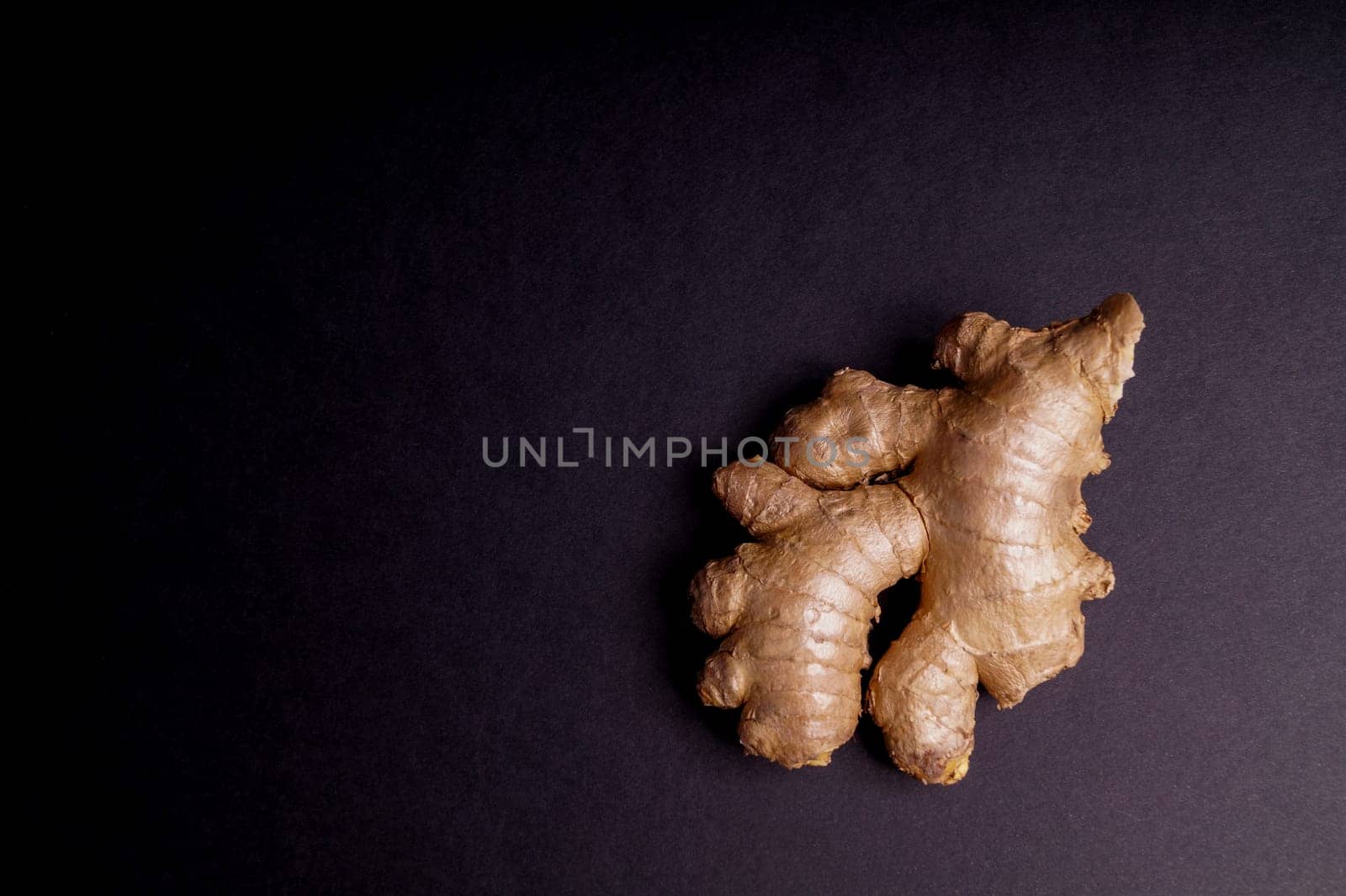 Fresh healthy ginger Root isolated on Black