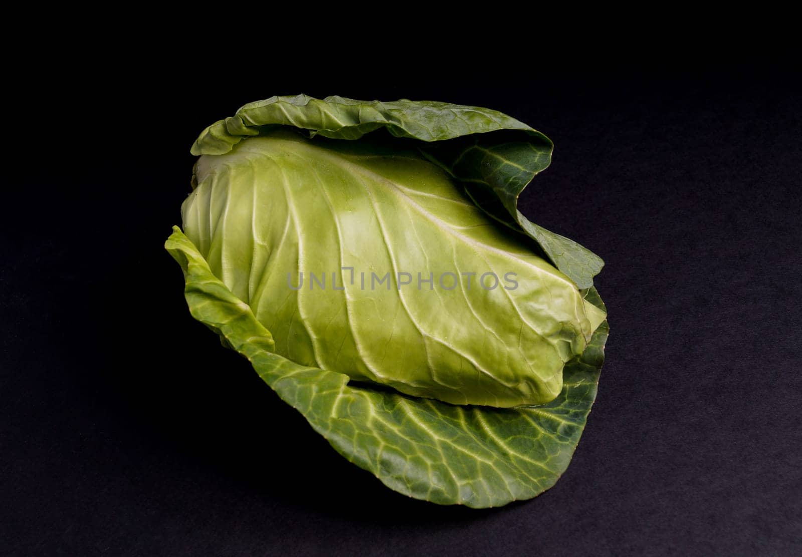Healthy Fresh Spring Cabbage isolated on Black