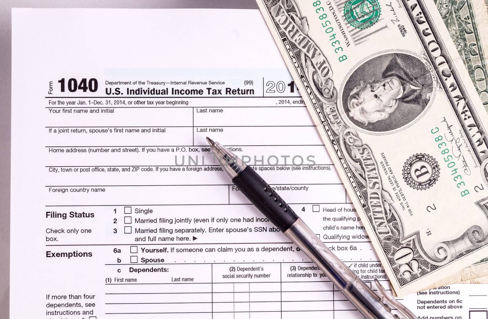 Tax form and Money. Filling the forms and hoping for a tax refund return