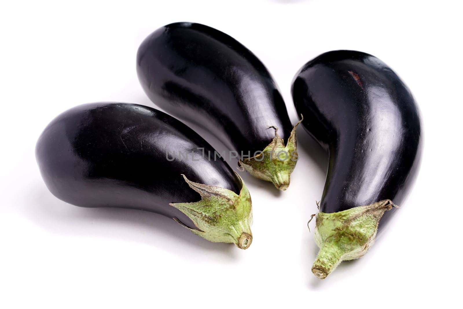 Three Healthy Organic Purple Eggplant, isolated on white