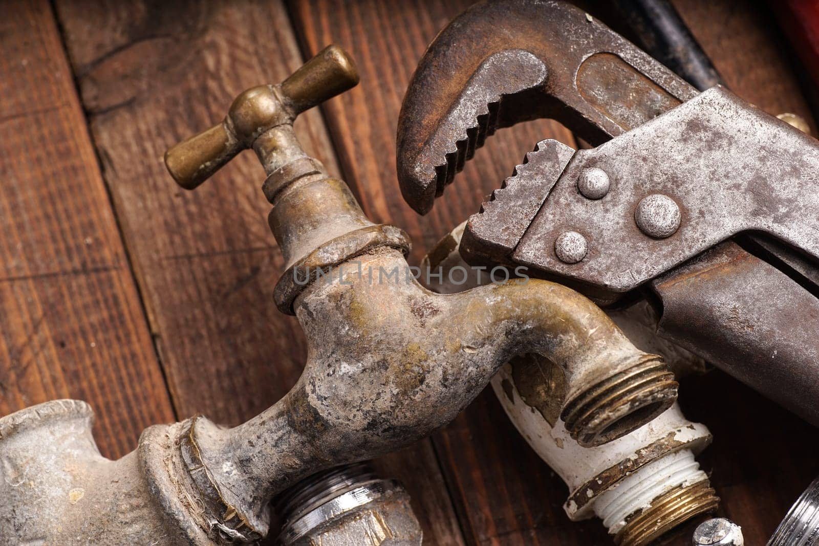 plumbing tools lying with old pipes and faucets