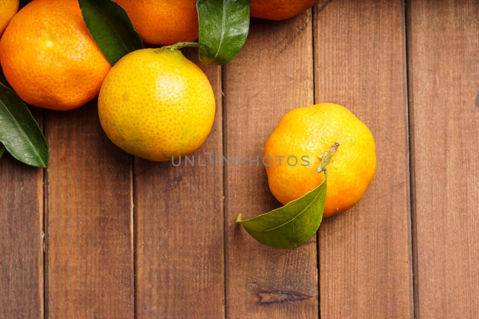 fresh organic clementines picked with green leaves