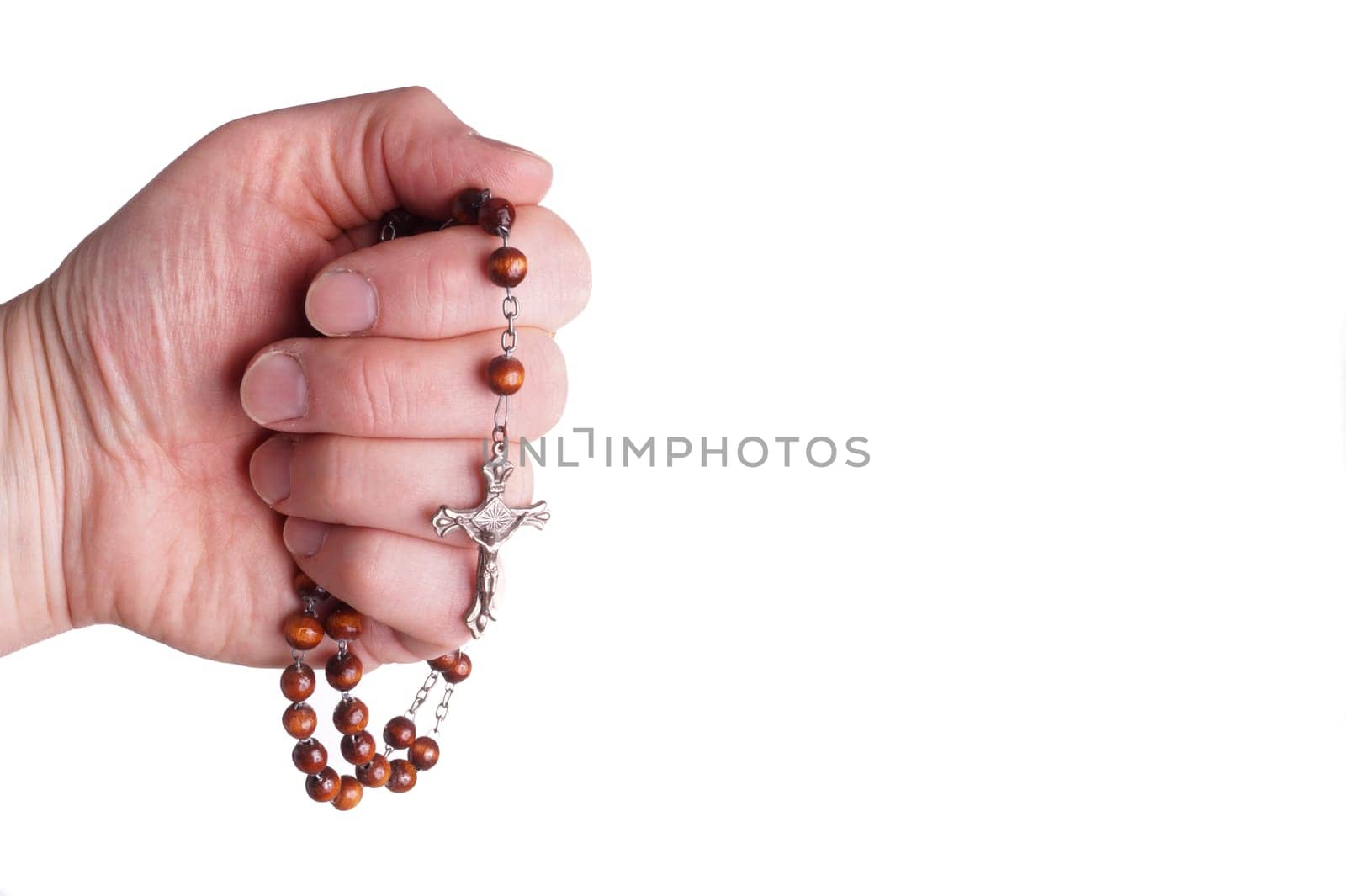 Hands of a woman Praying with Rosary, isoalted on white