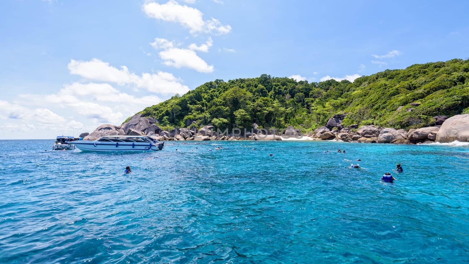 Tourists enjoyed snorkelling on blue sea and sky during summer at Ko Ba Ngu Island in Mu Ko Similan National Park, Phang Nga province, Thailand, 16