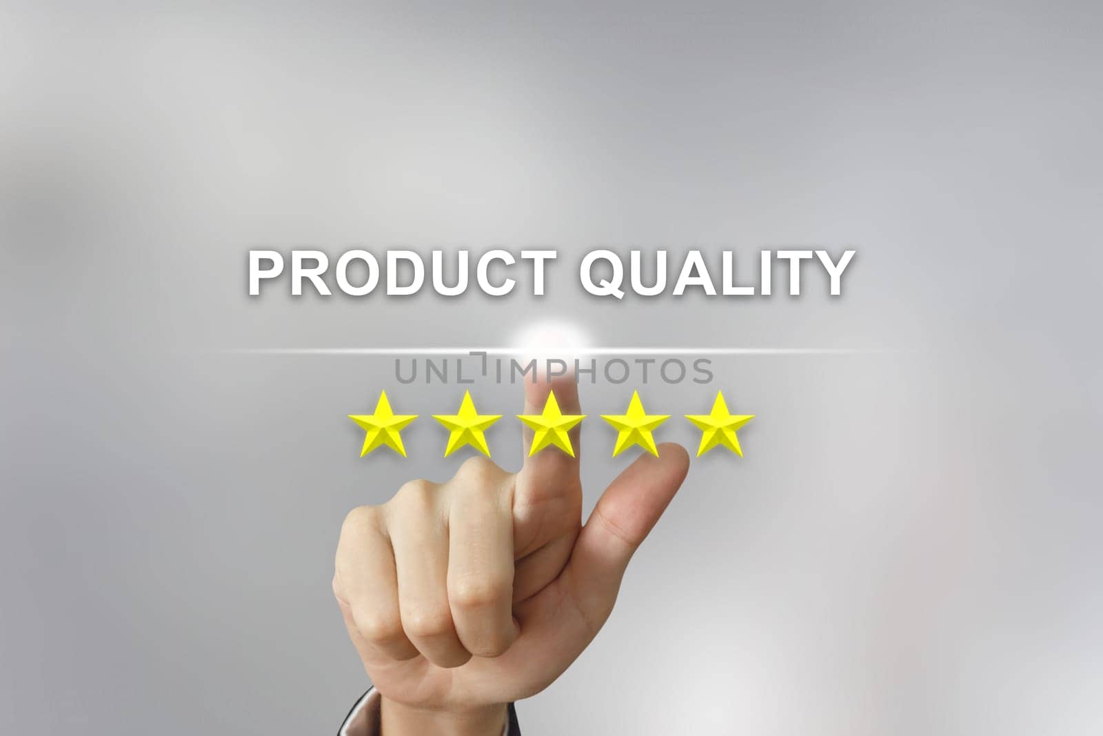 business hand clicking product quality with five stars on screen