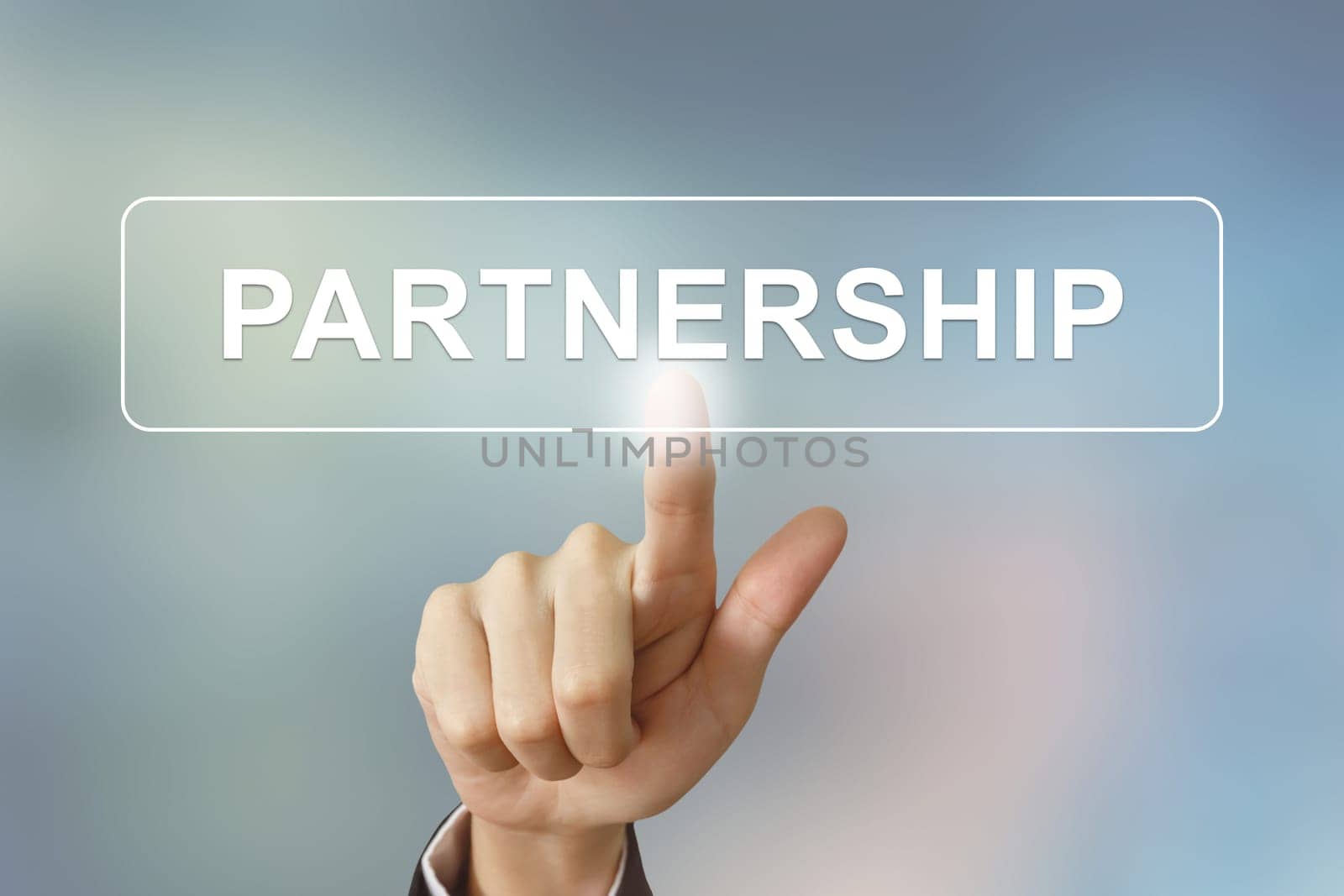 business hand pushing partnership button on blurred background
