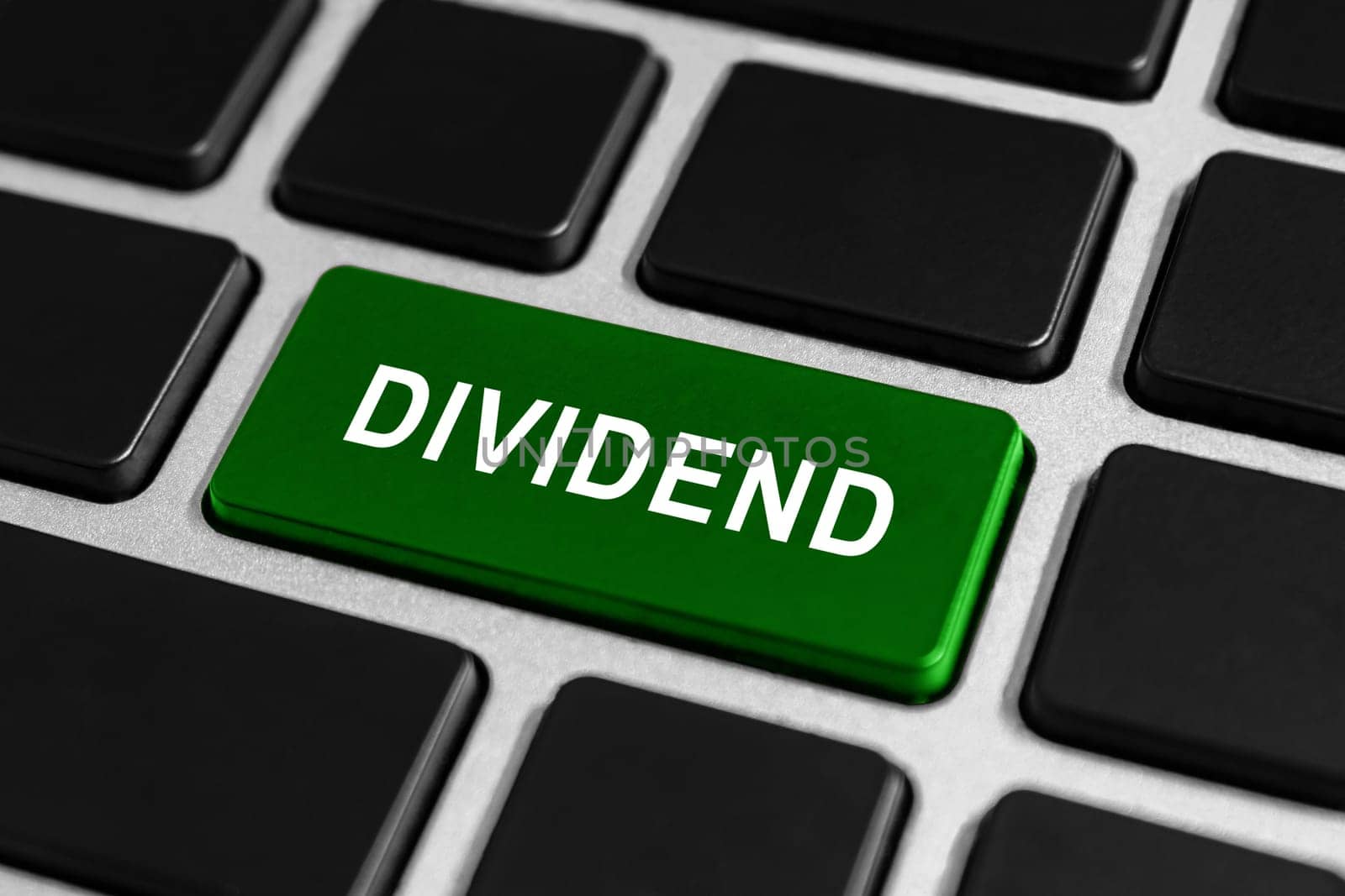 dividend green button on keyboard, business concept