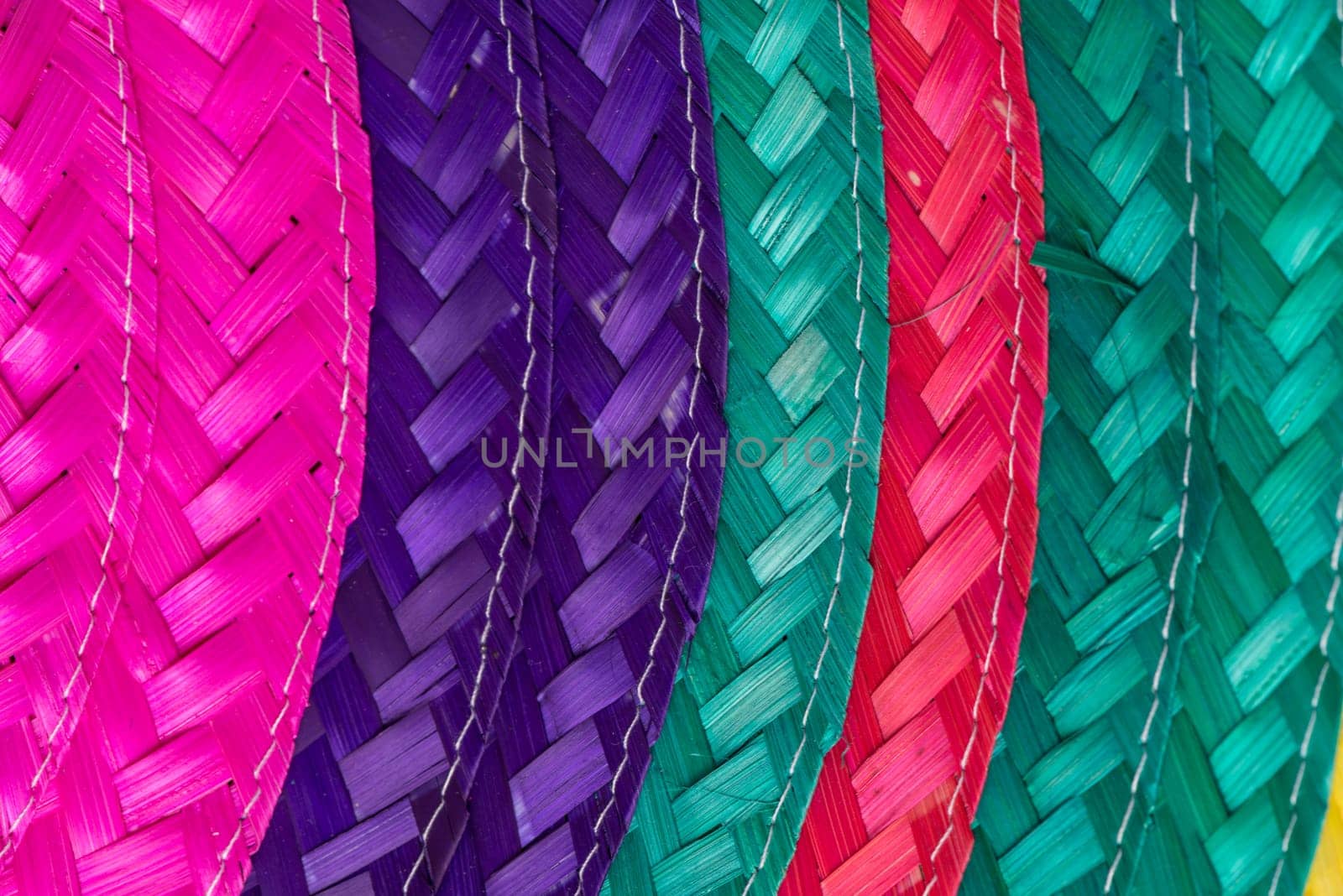 Abstract colorful background of woven straw.