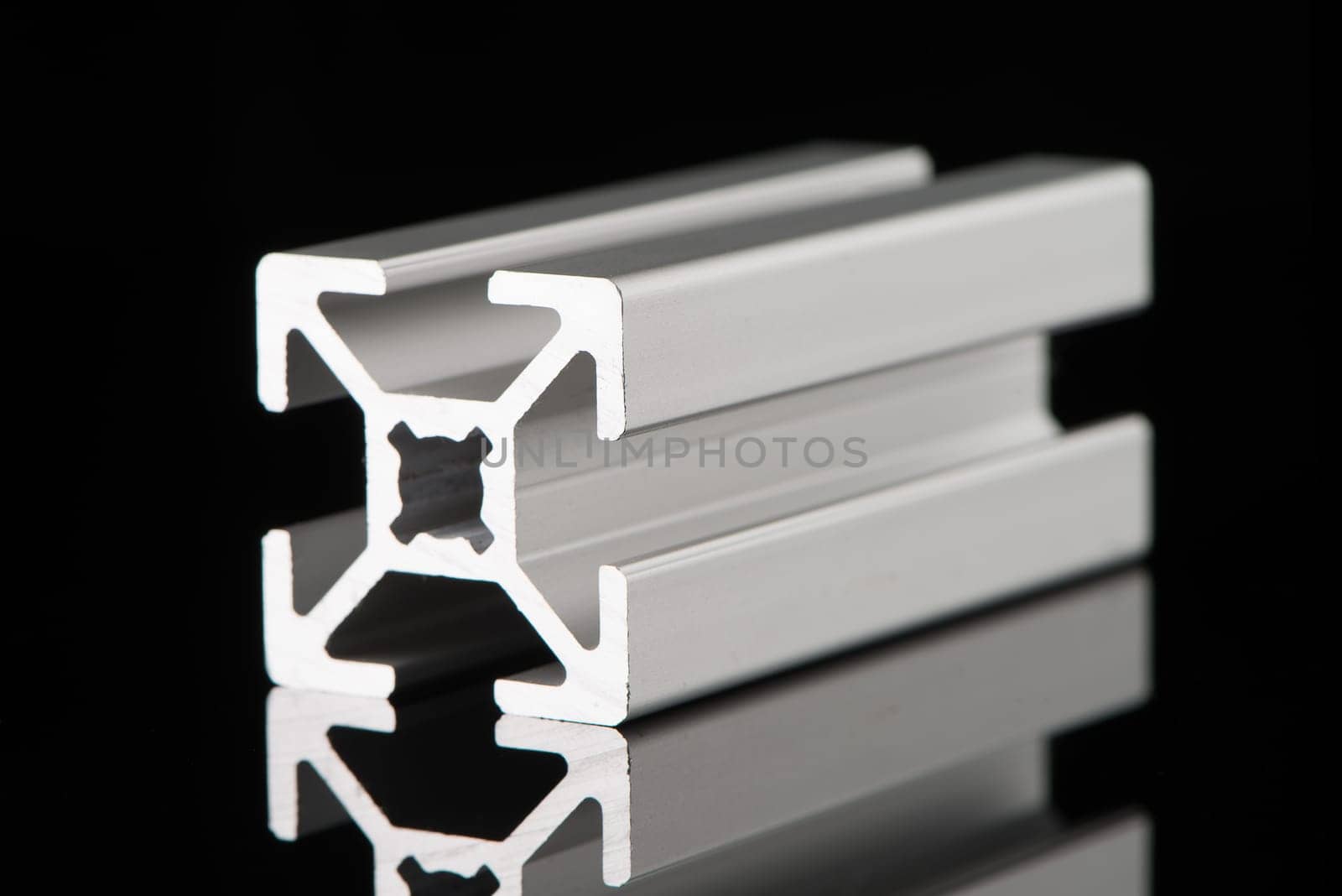 Aluminium profile sample isolated on black background.