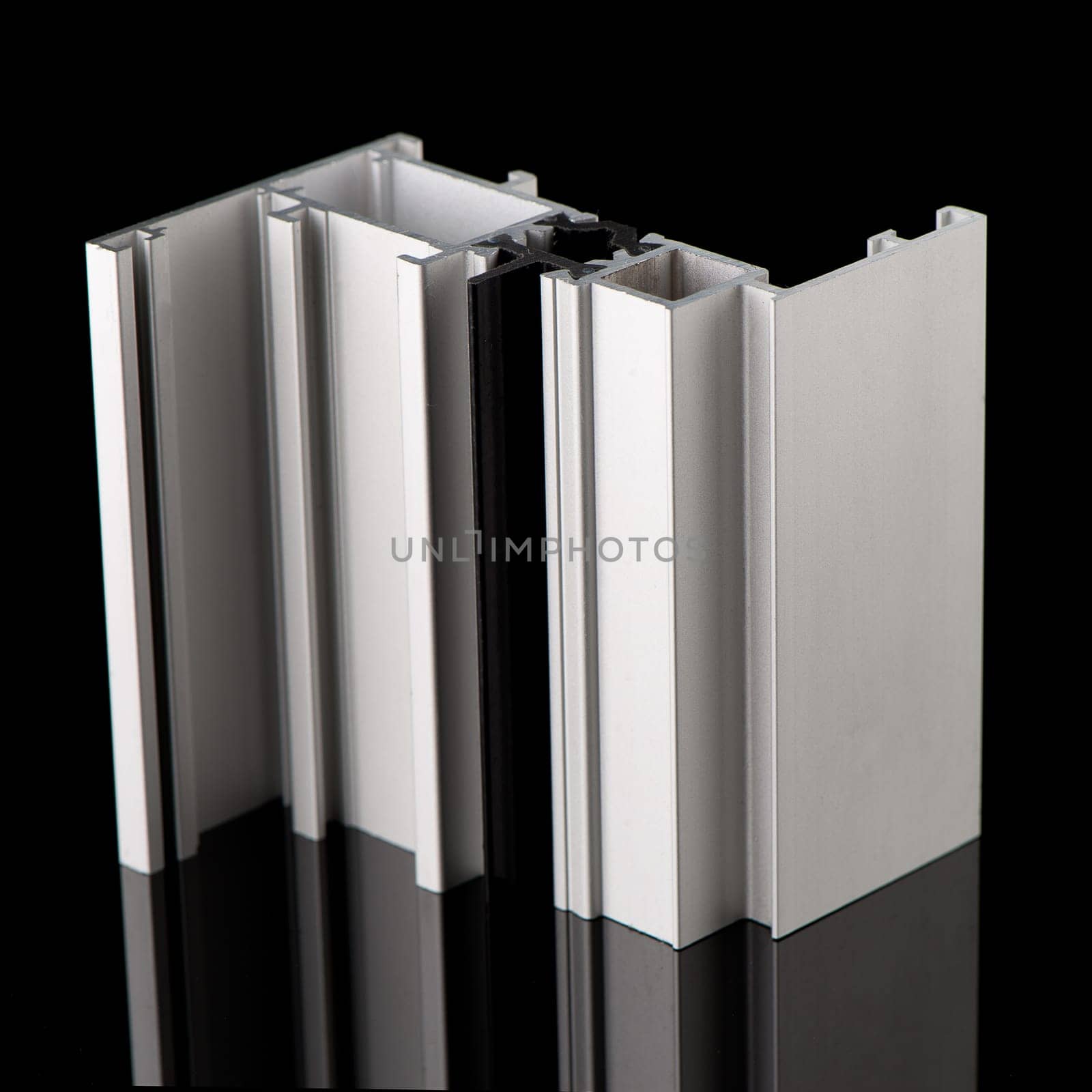 Aluminium profile sample isolated on black background.