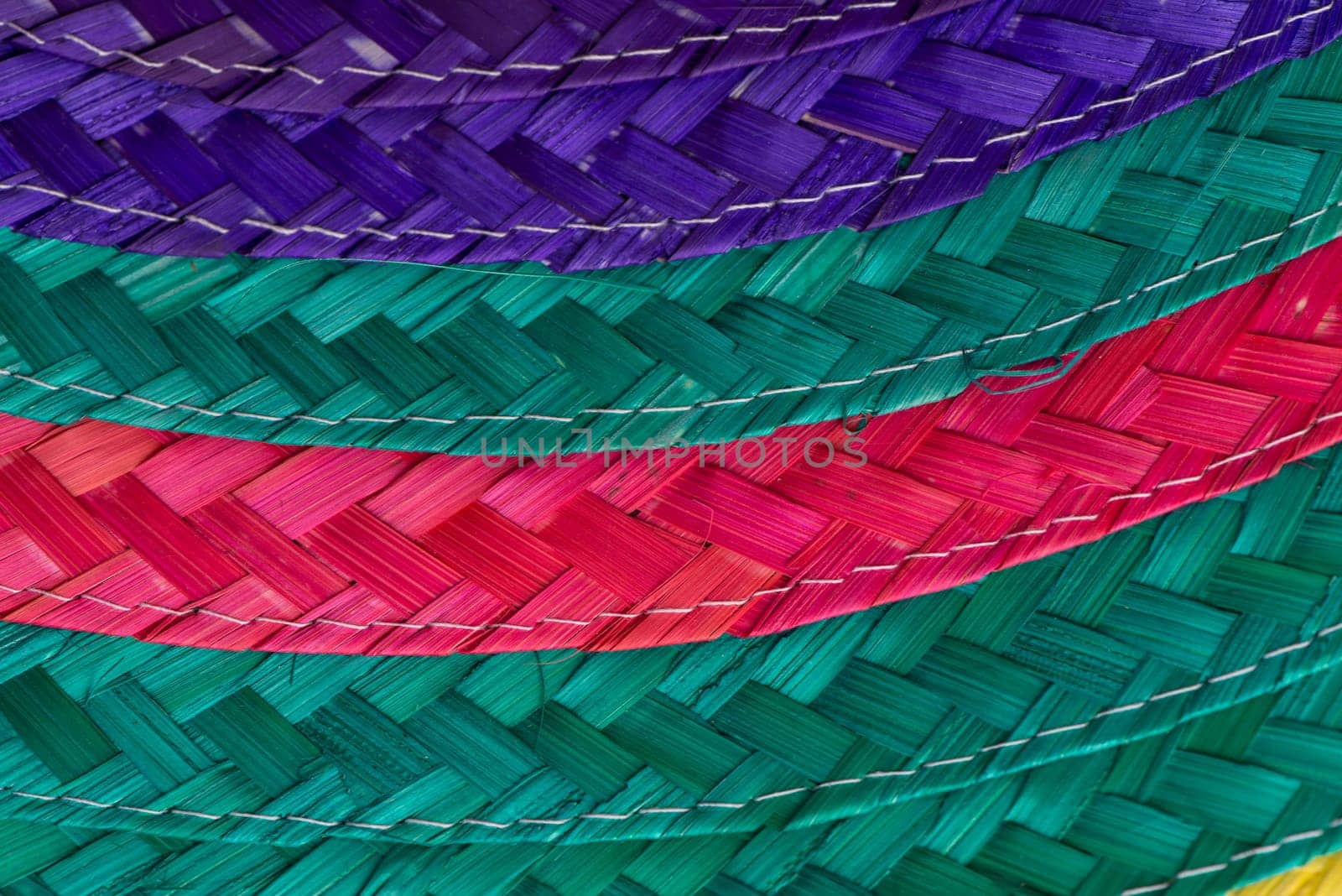 Abstract colorful background of woven straw.