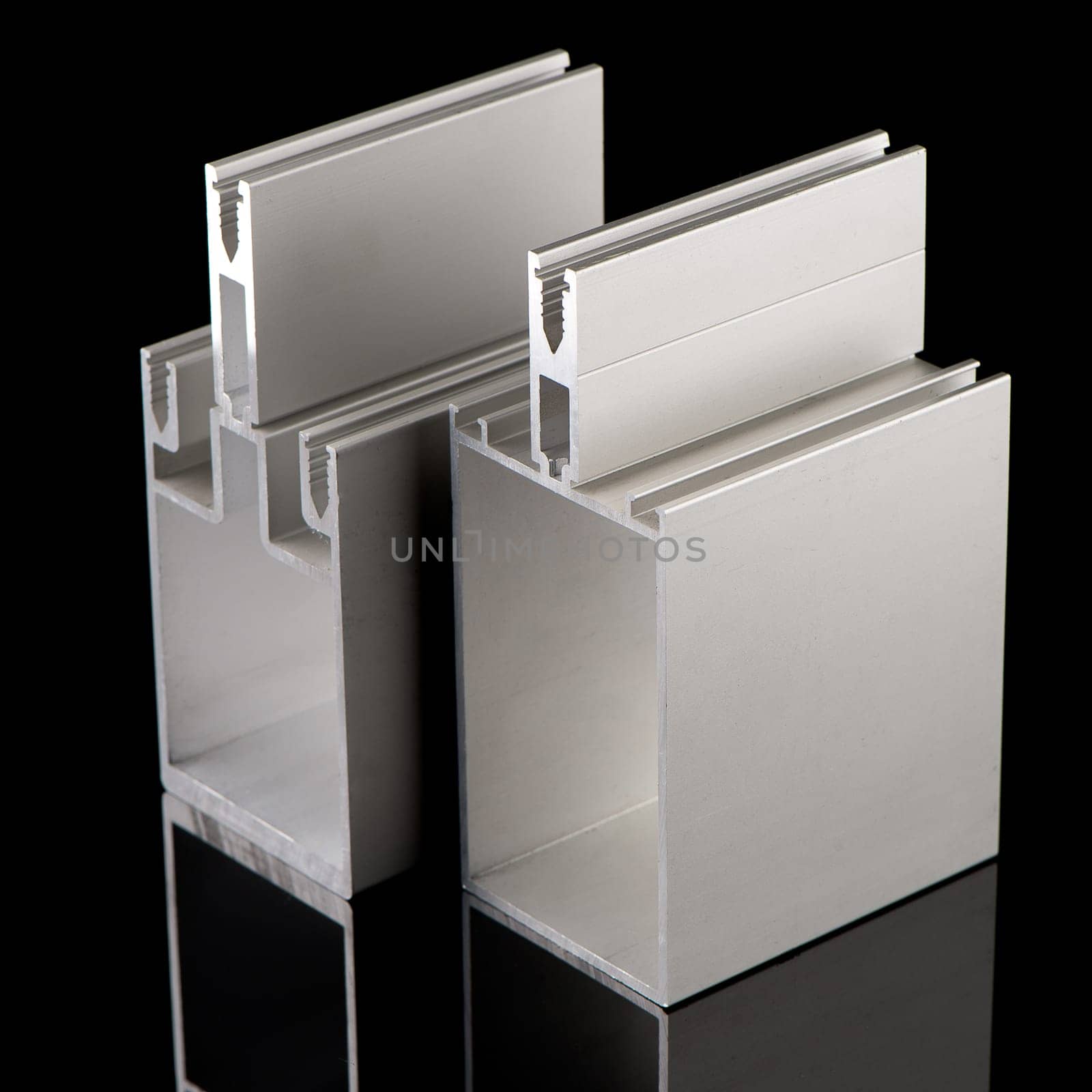 Aluminium profile sample isolated on black background.