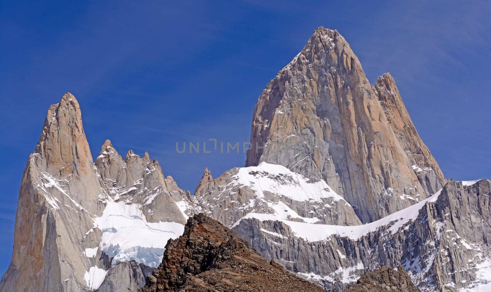 Dramatic Peaks Piercing a Blue Sky in the Patagonian Andes of Glaciares National Park in Argentina