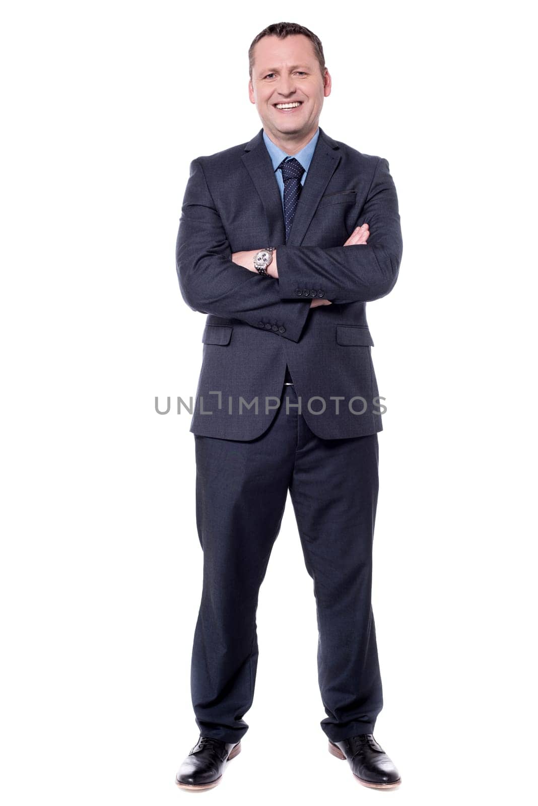 Confident businessman isolated on white with folded arms