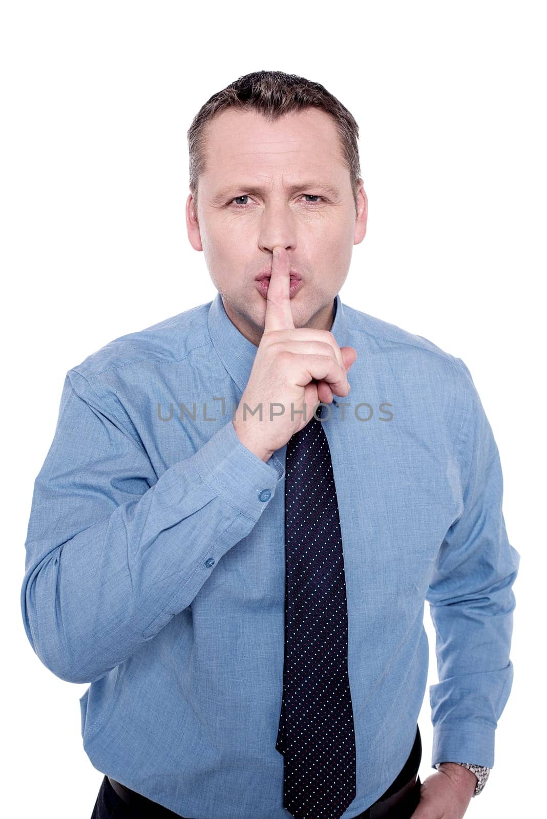 Handsome male executive instruct to keep silence