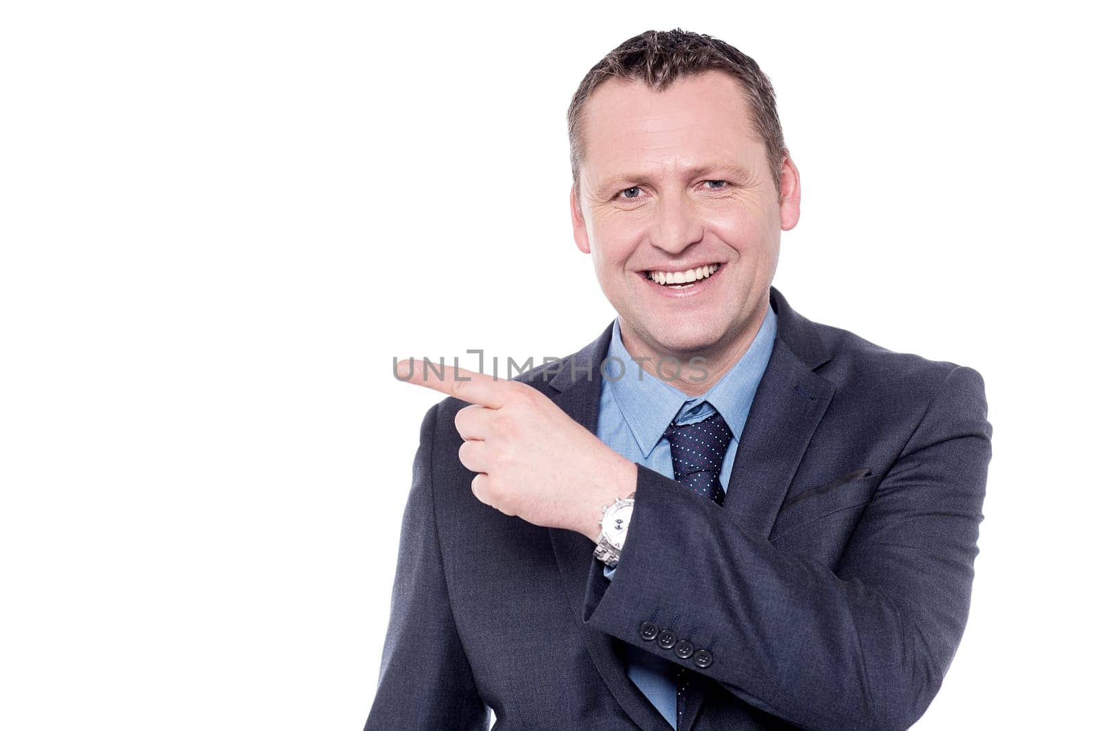 Businessman pointing his index finger at copy space