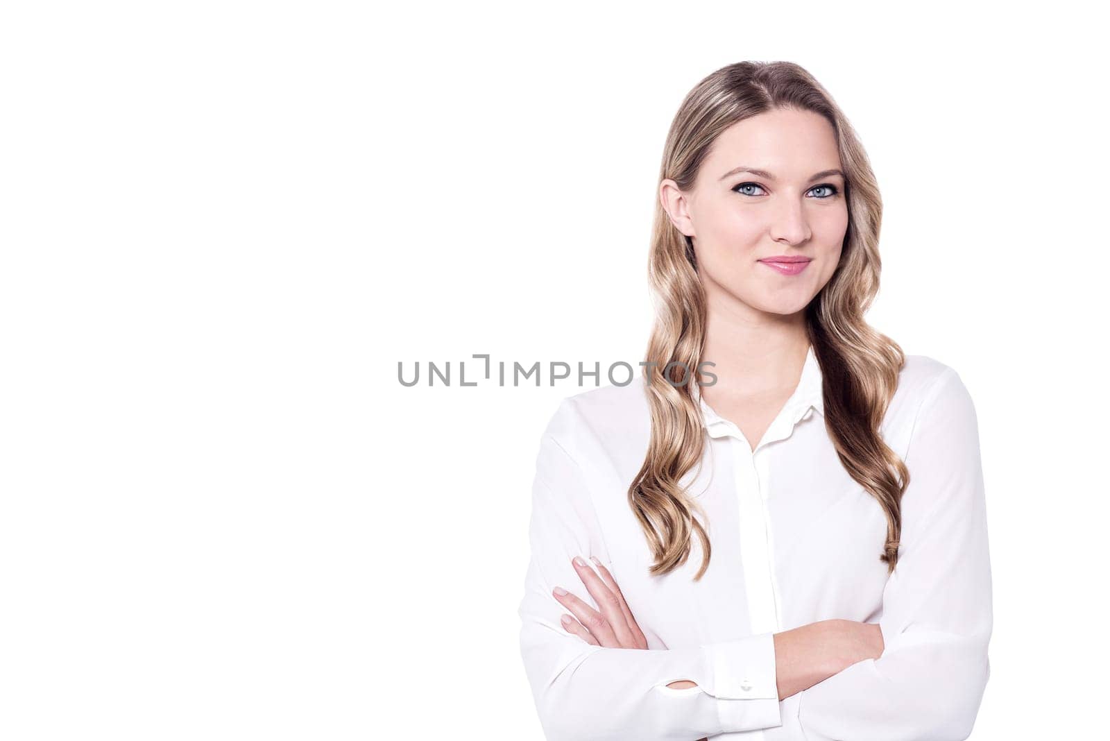 Confident young business woman keeping arms crossed