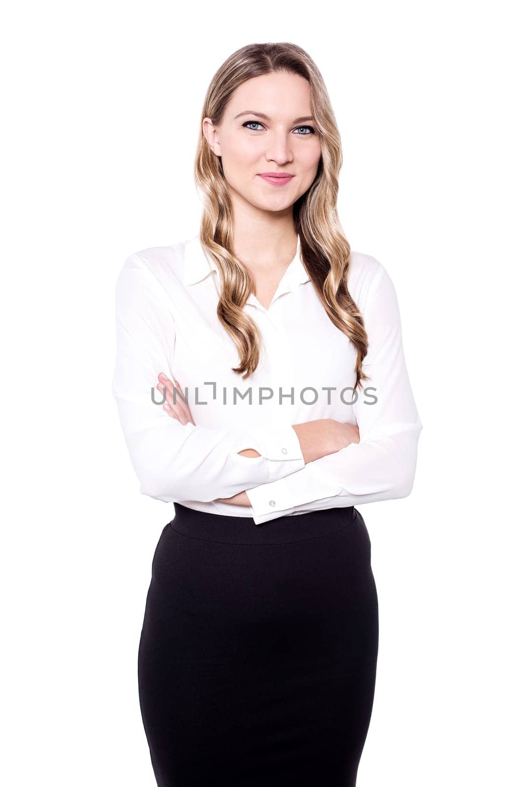 Confident woman posing to camera with crossed arms