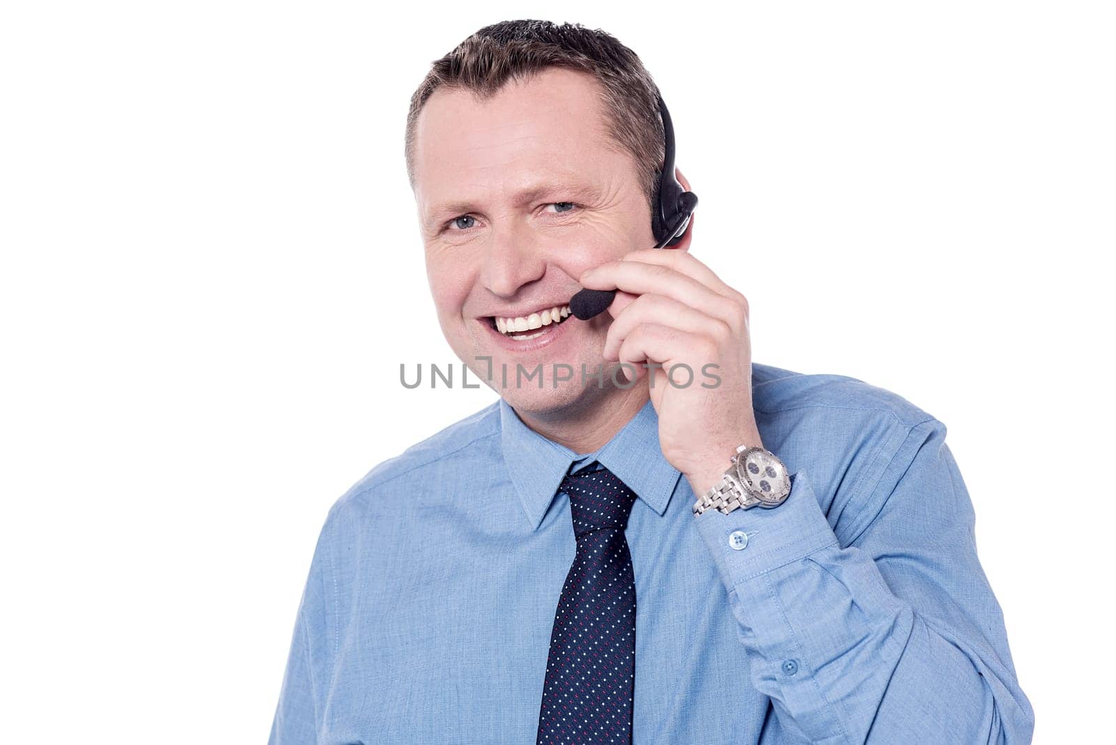 Customer support executive adjusting headphone over white