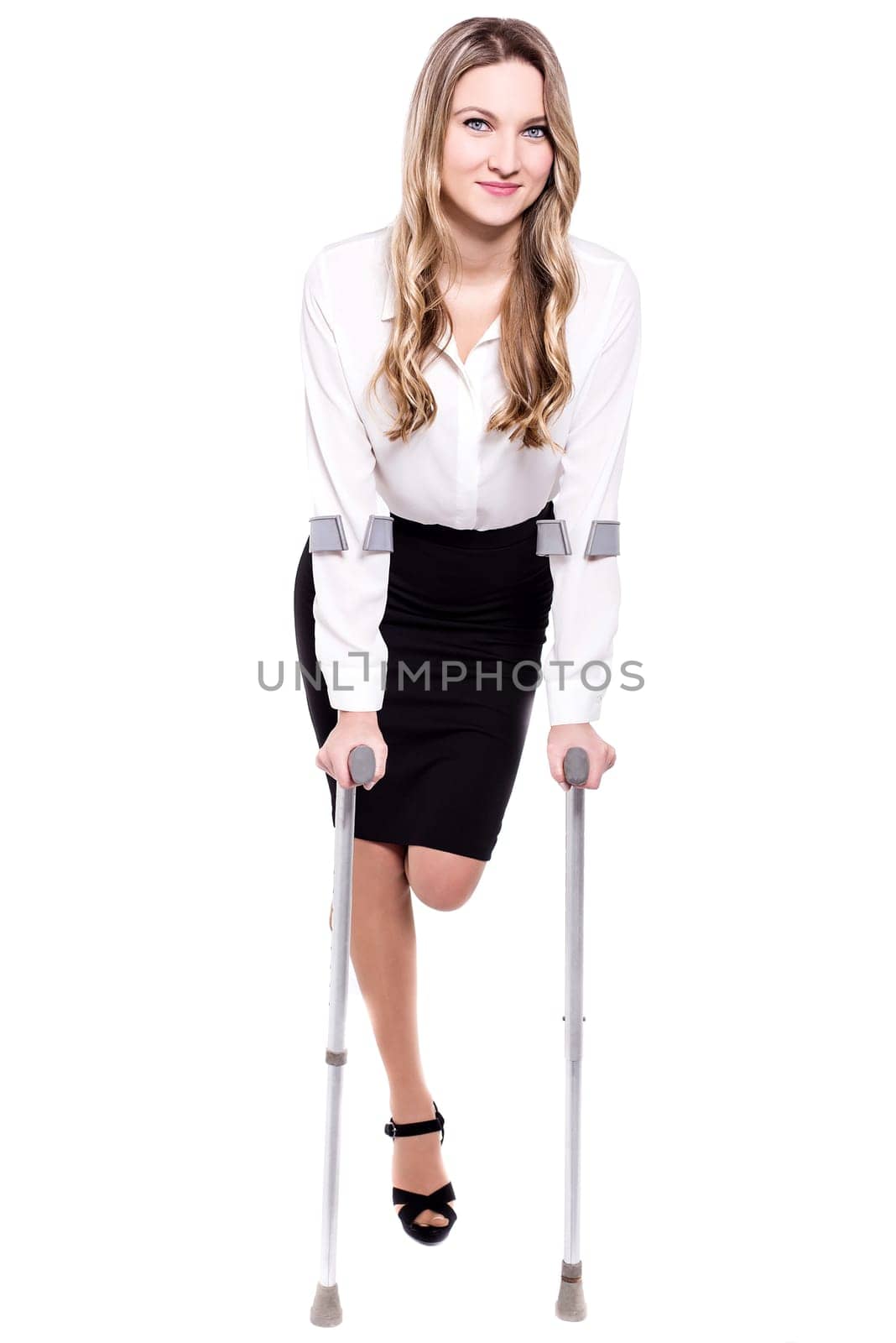Young business woman with crutches, isolated on white