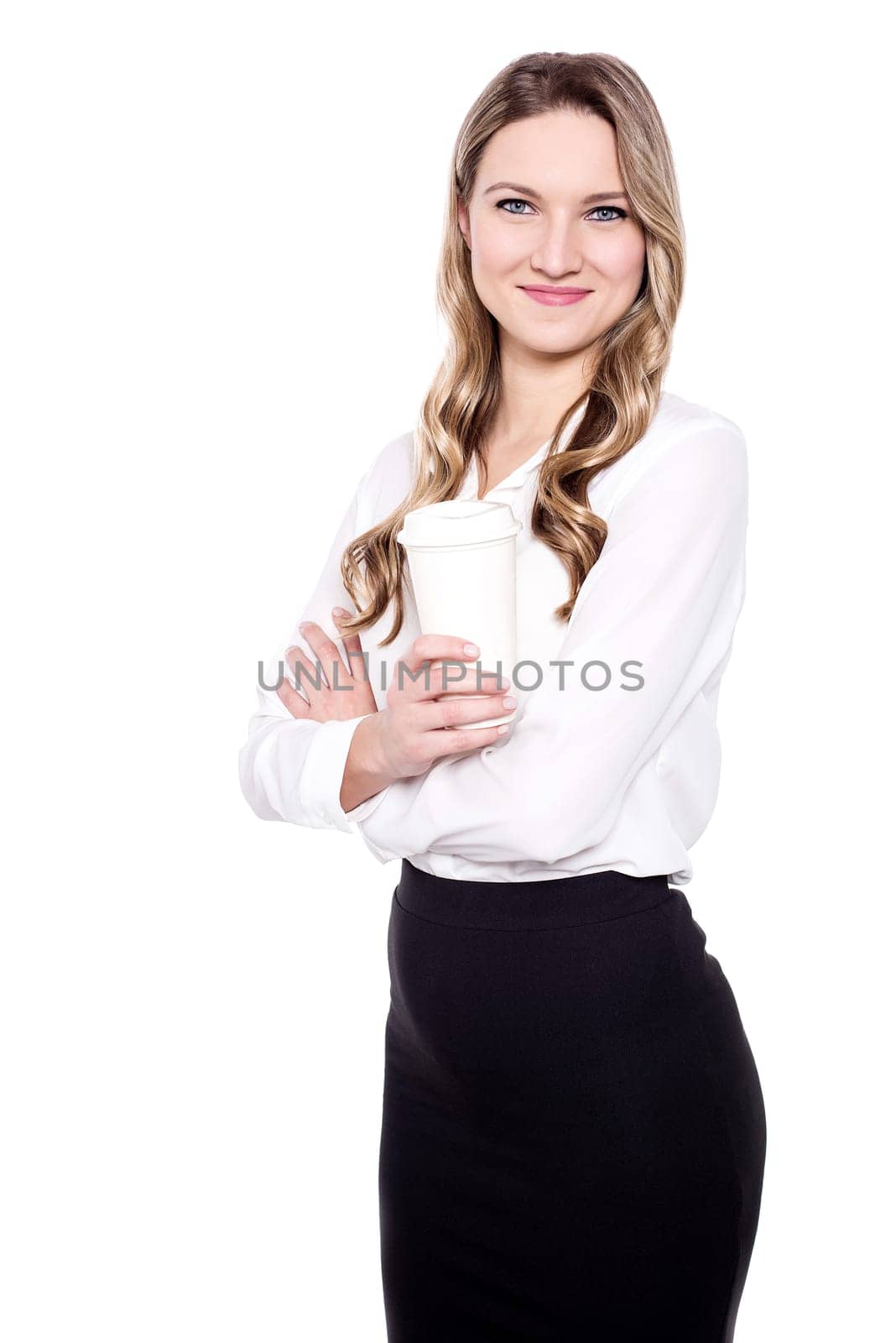 Female executive holding coffee cup in her hand