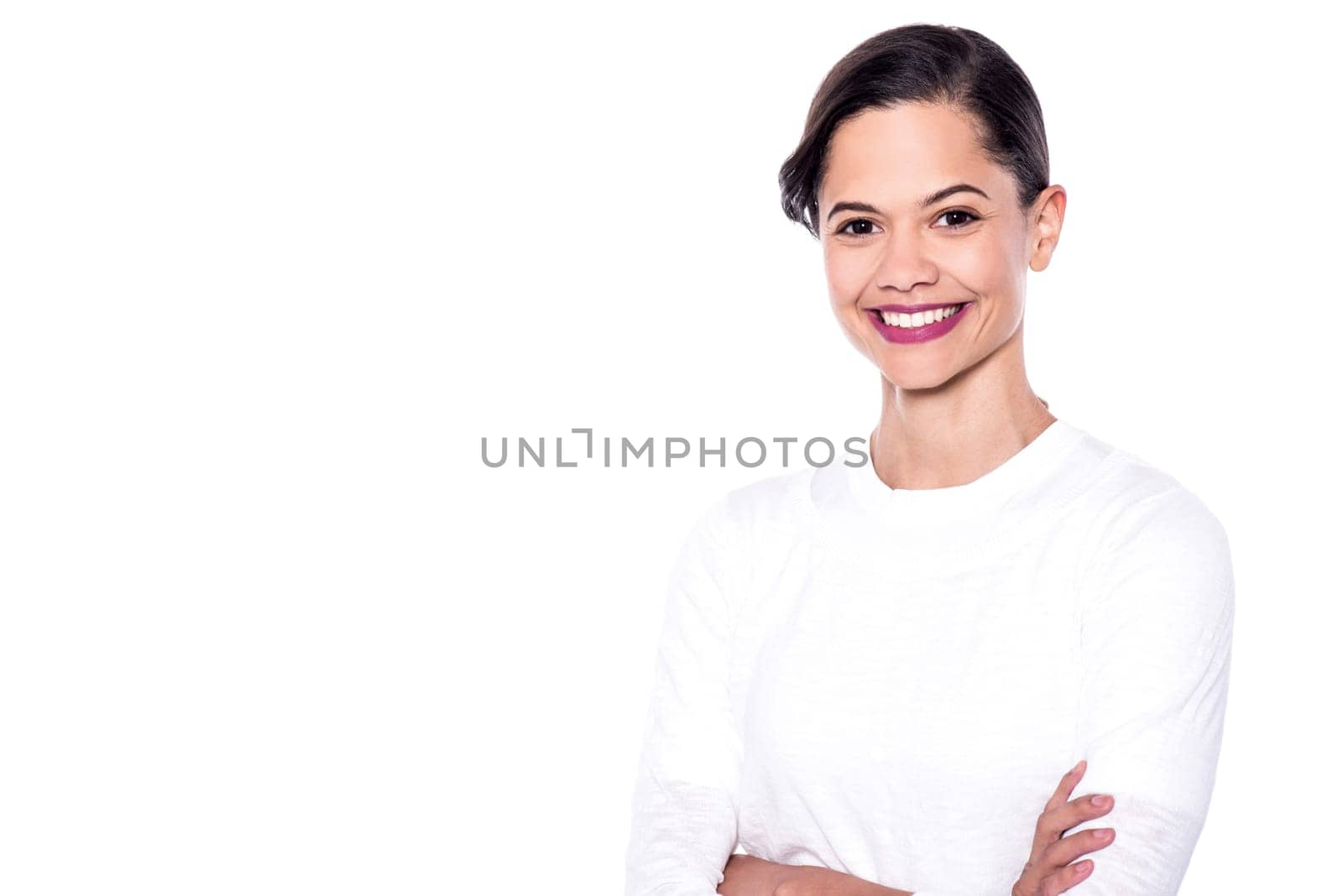 Happy young woman posing with crossed arms