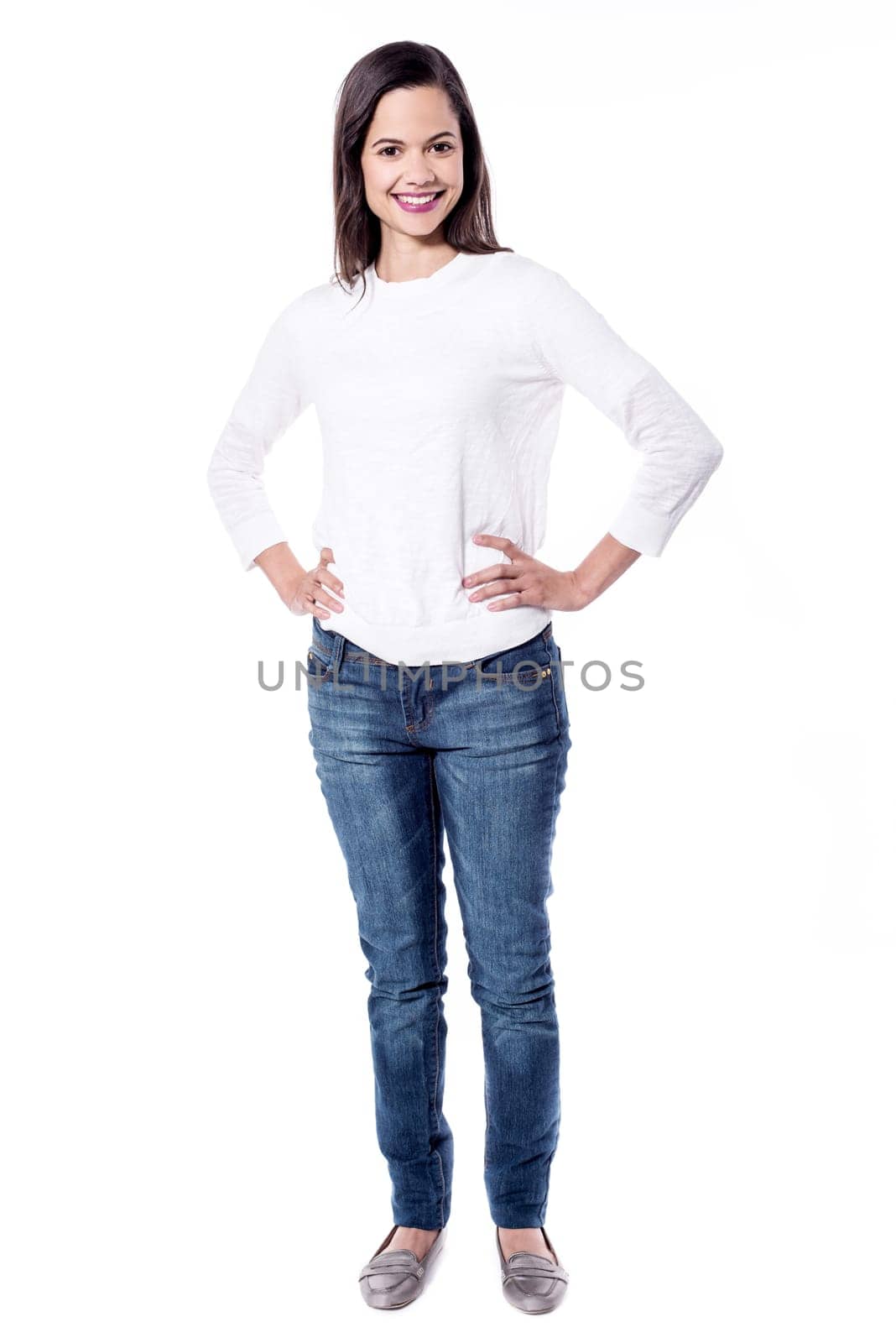 Pretty young woman standing with hands on waist